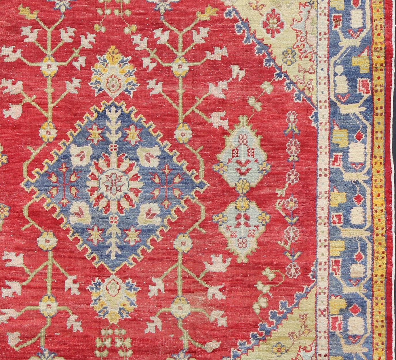 Hand-Knotted  Antique Turkish Oushak in yellow Green, Red & Blue with Floral Medallion Design For Sale