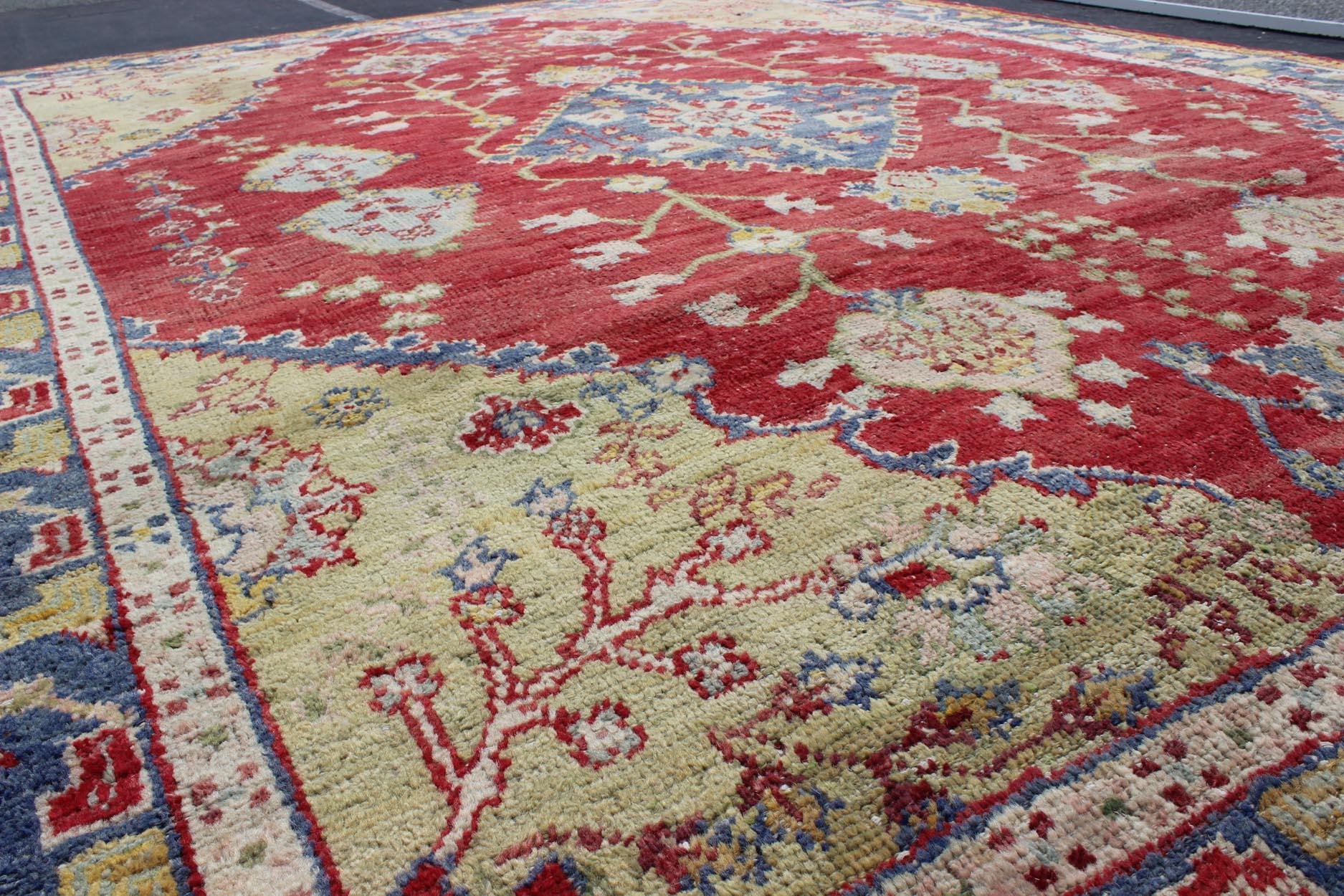 20th Century  Antique Turkish Oushak in yellow Green, Red & Blue with Floral Medallion Design For Sale