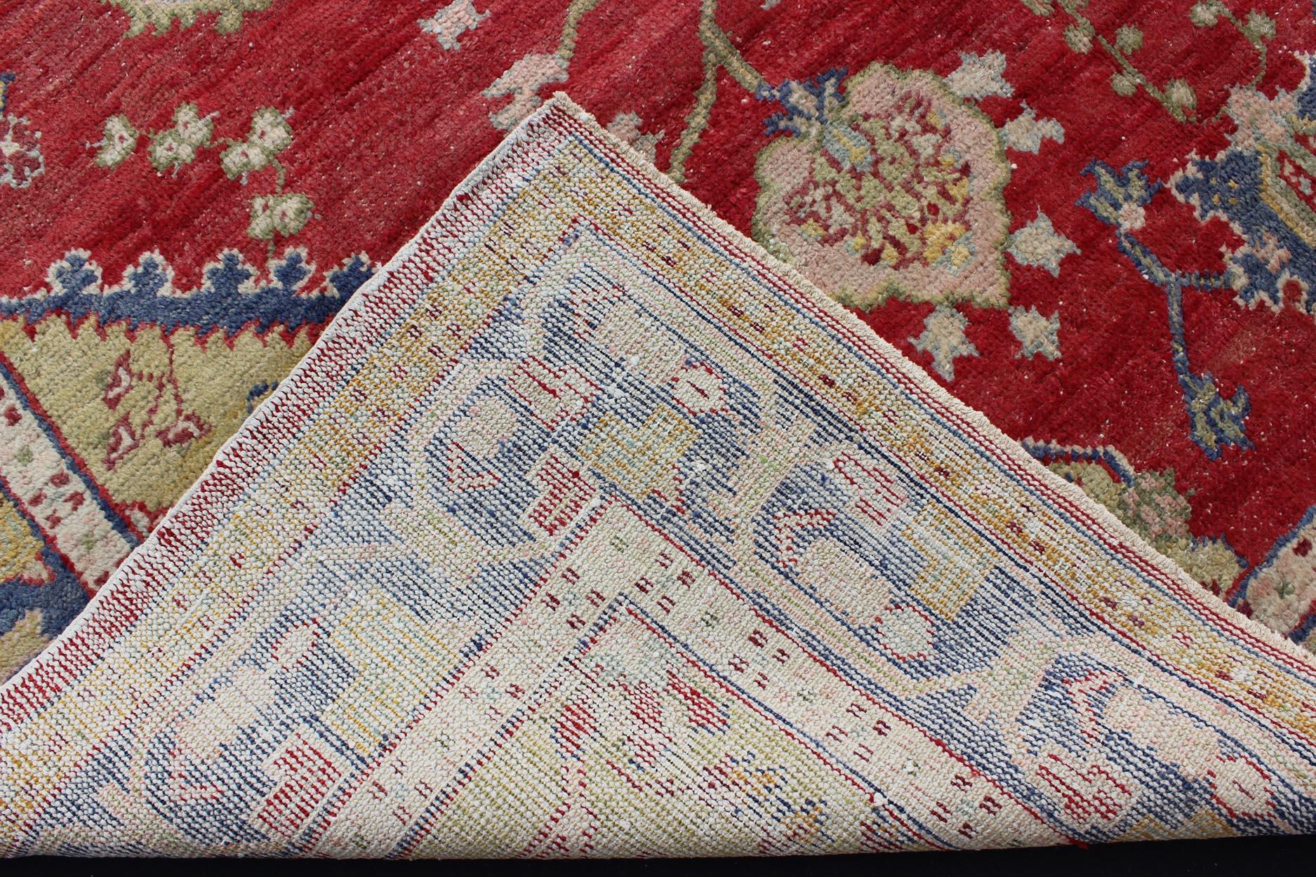 Wool  Antique Turkish Oushak in yellow Green, Red & Blue with Floral Medallion Design For Sale