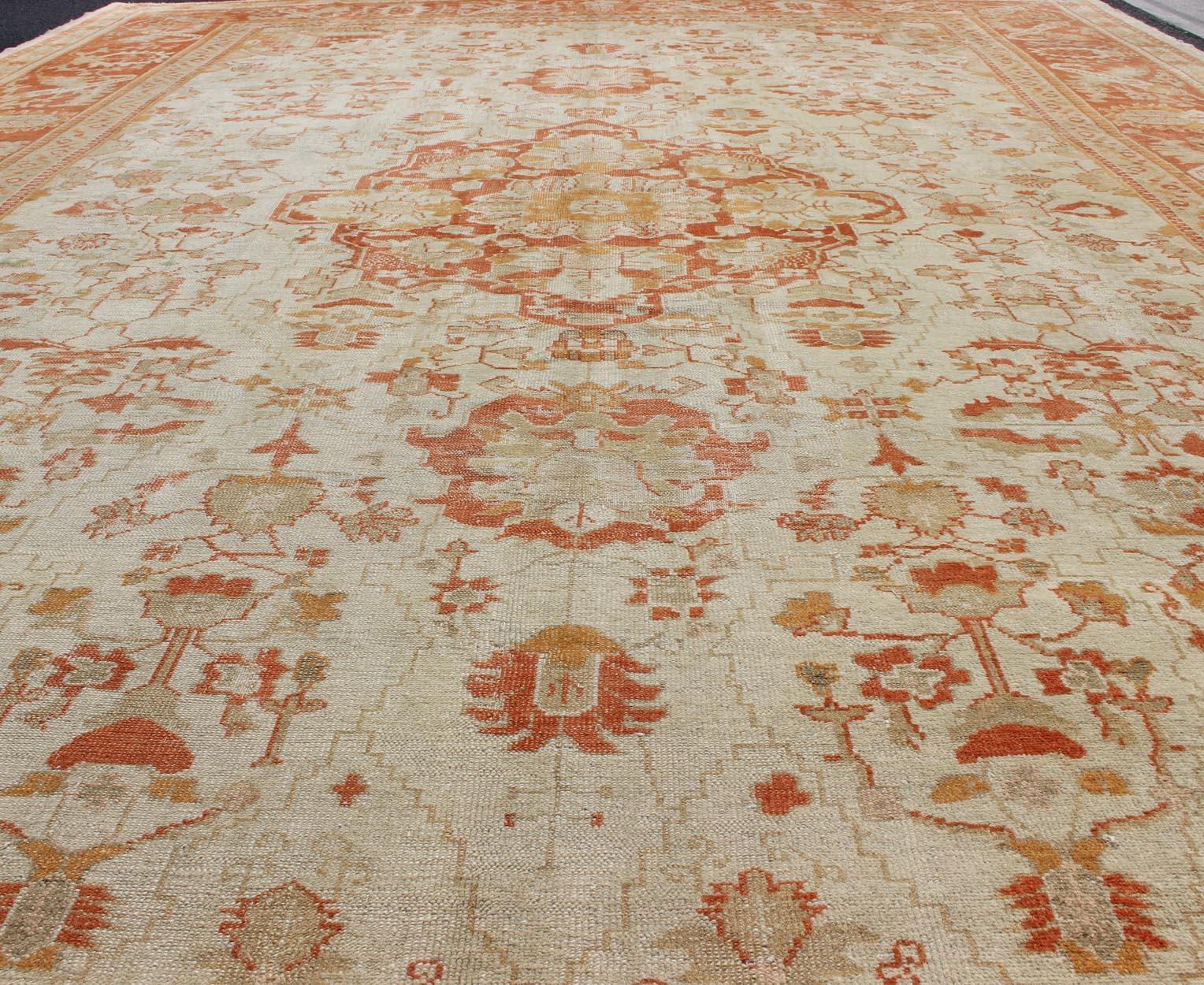 Antique Turkish Floral Oushak Rug in Cream,  Rust Red, Orange and Green For Sale 8