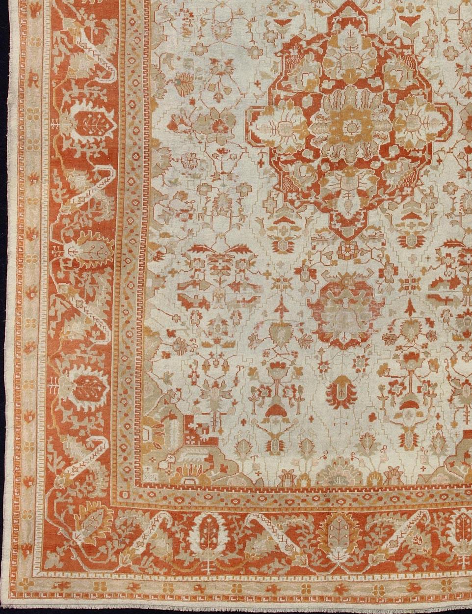 Hand-Knotted Antique Turkish Floral Oushak Rug in Cream,  Rust Red, Orange and Green   For Sale