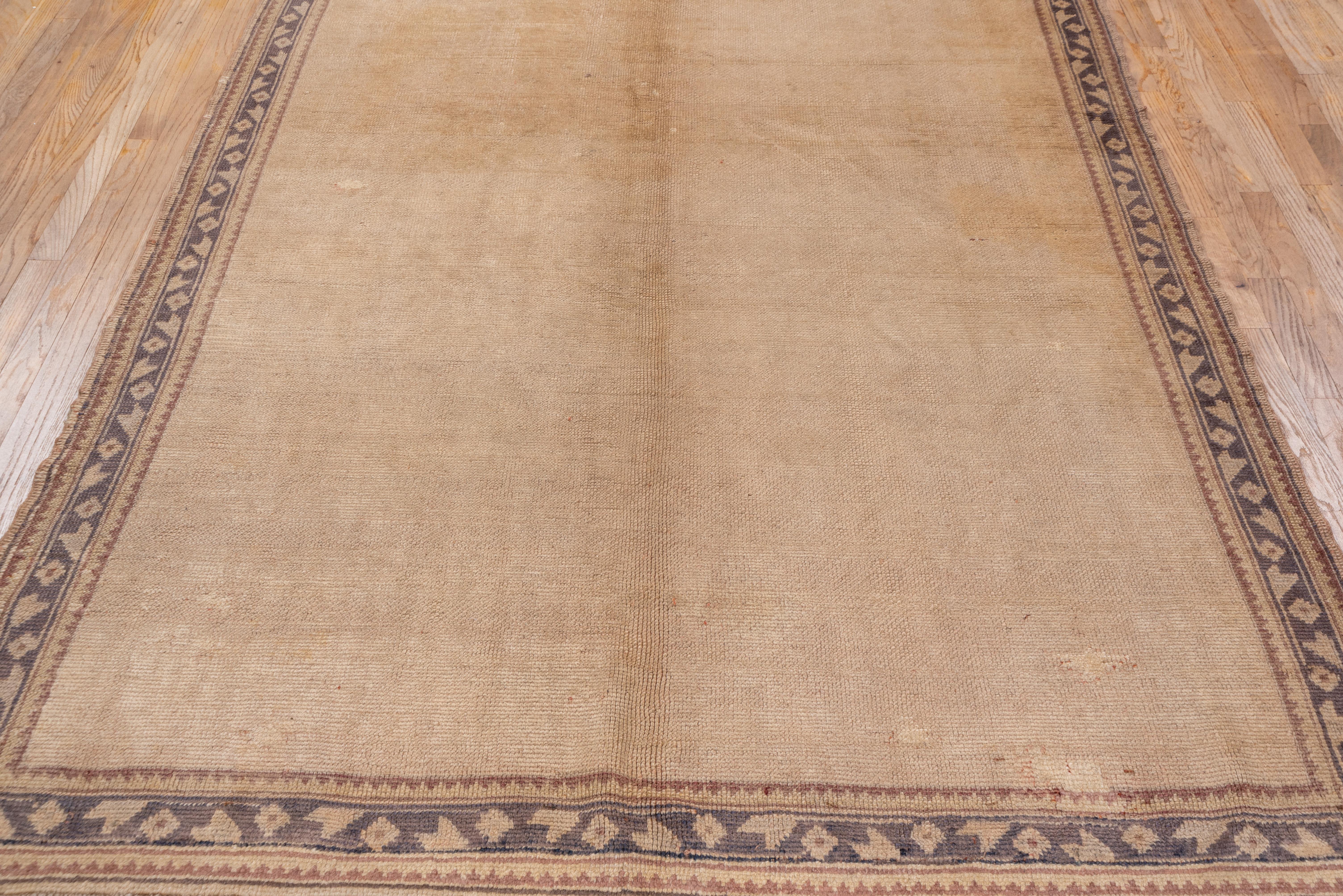 Wool Antique Turkish Oushak Gallery Rug, Solid Ivory & Eggshell Field, Indigo Borders For Sale