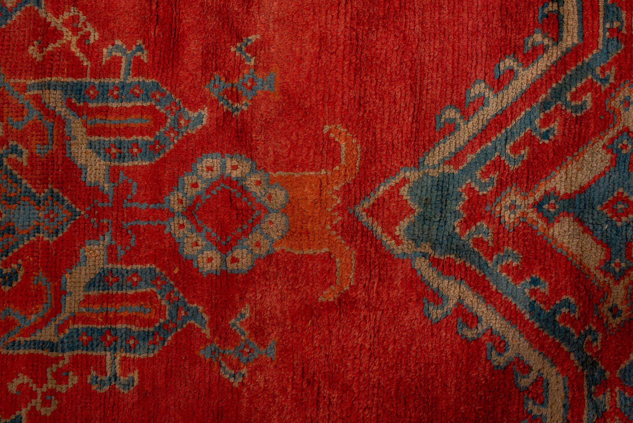 The Antique Turkish Oushak rug is a handwoven piece that holds historical and cultural significance. Oushak rugs, also known as Ushak rugs, originated in the city of Oushak in western Turkey. They are renowned for their intricate designs, vibrant