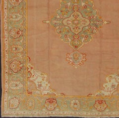Antique Turkish Oushak in Pink Background and Light Green Border