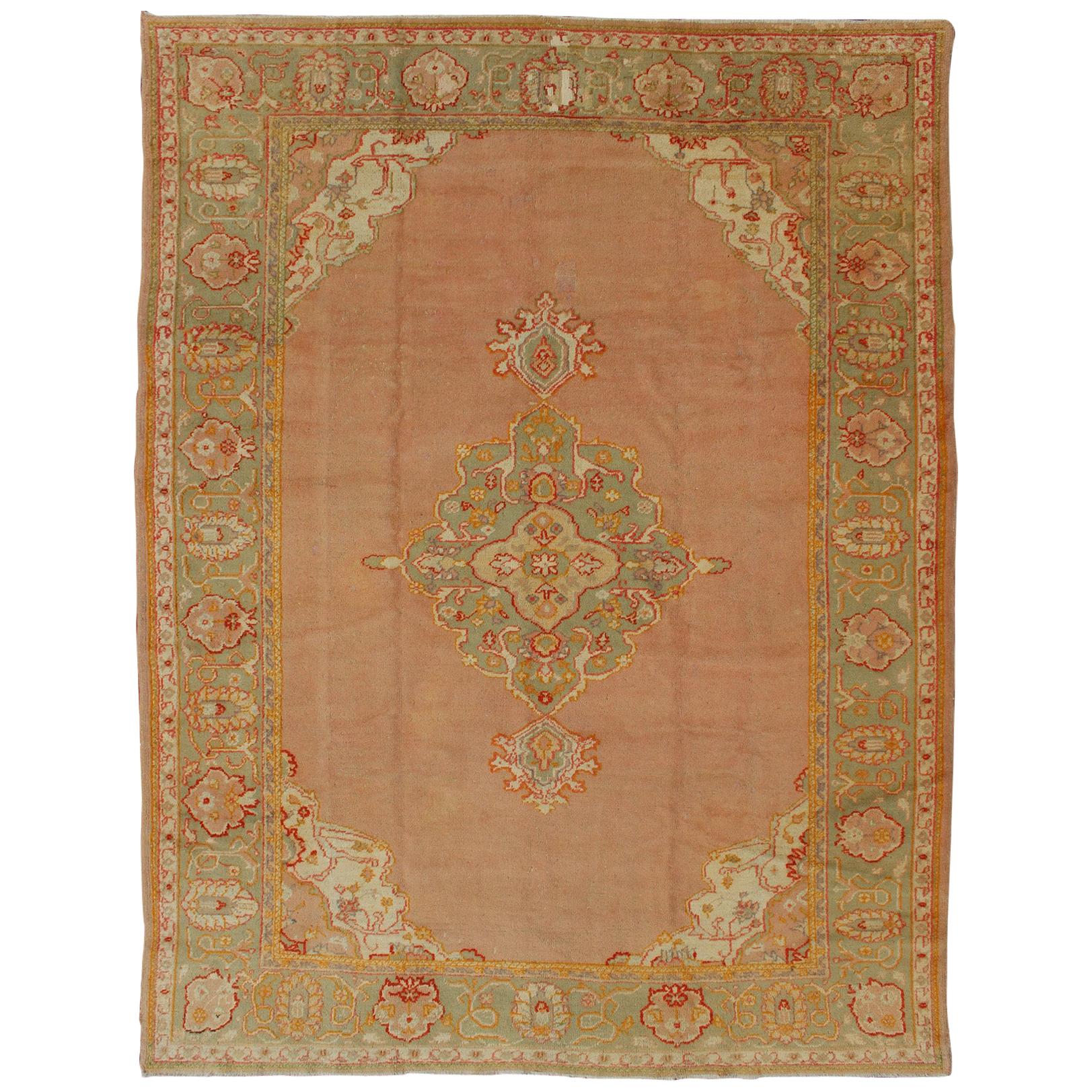 Antique Turkish Oushak in Pink Background and Light Green Border For Sale