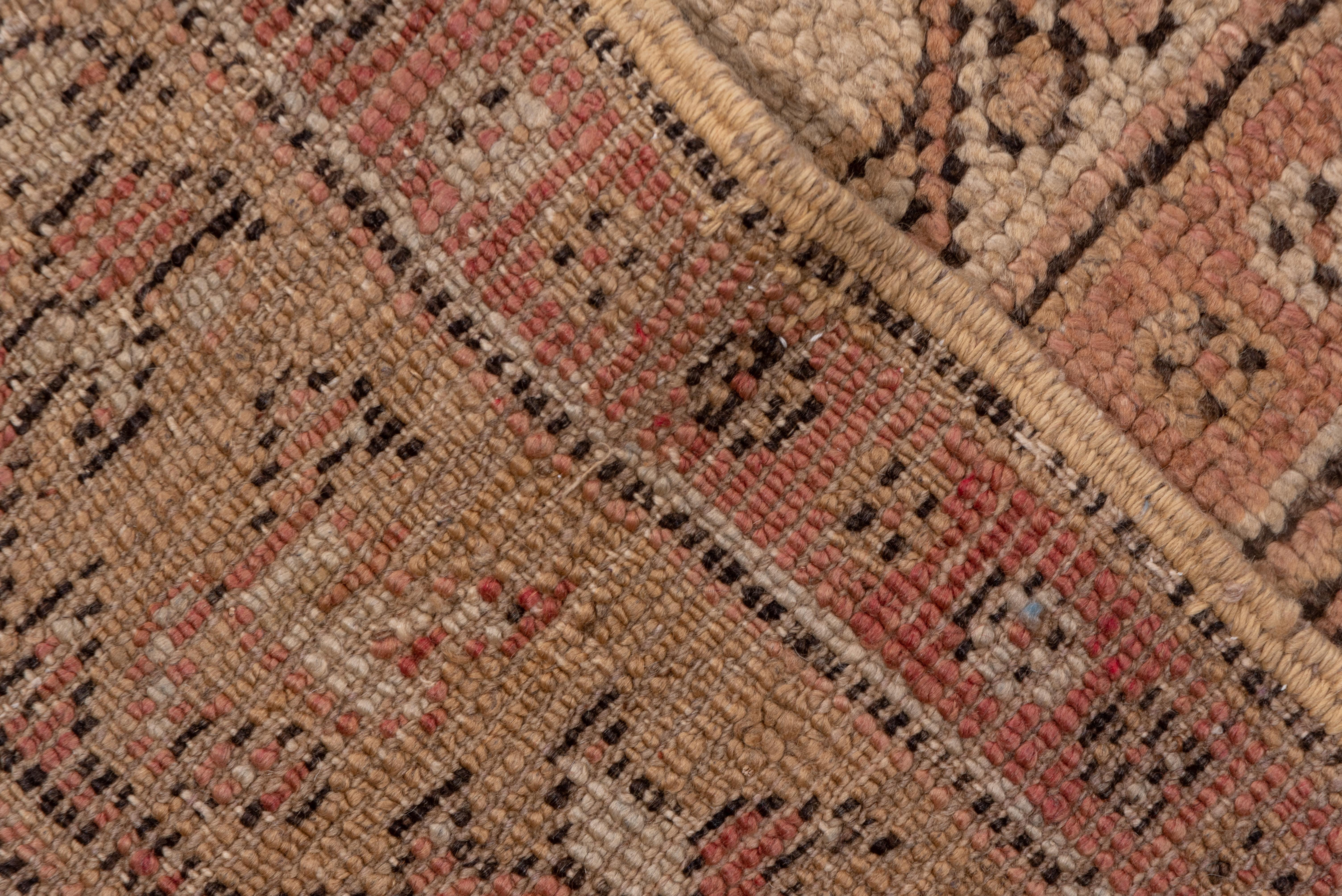 This magnificent west Turkish carpet is in the classical Ottoman style somewhat removed with d closely dotted red-brown field displaying a central hexagon medallion and pendanted fractional octogramme corners. Two of the six borders present distinct