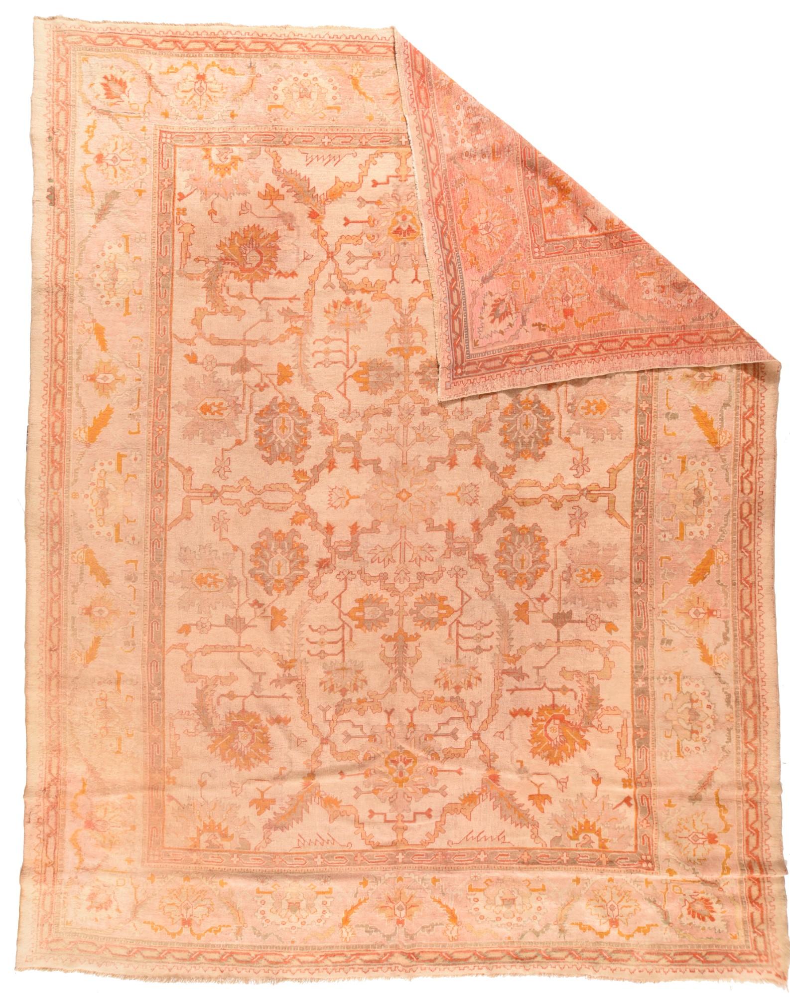 Antique Turkish Oushak rug meassures 11'4'' x 14'4''. The cream-straw field shows eight goldenrod petal palmettes controlling an arabesque, teem and leaf pattern vaguely reminiscent of classic 