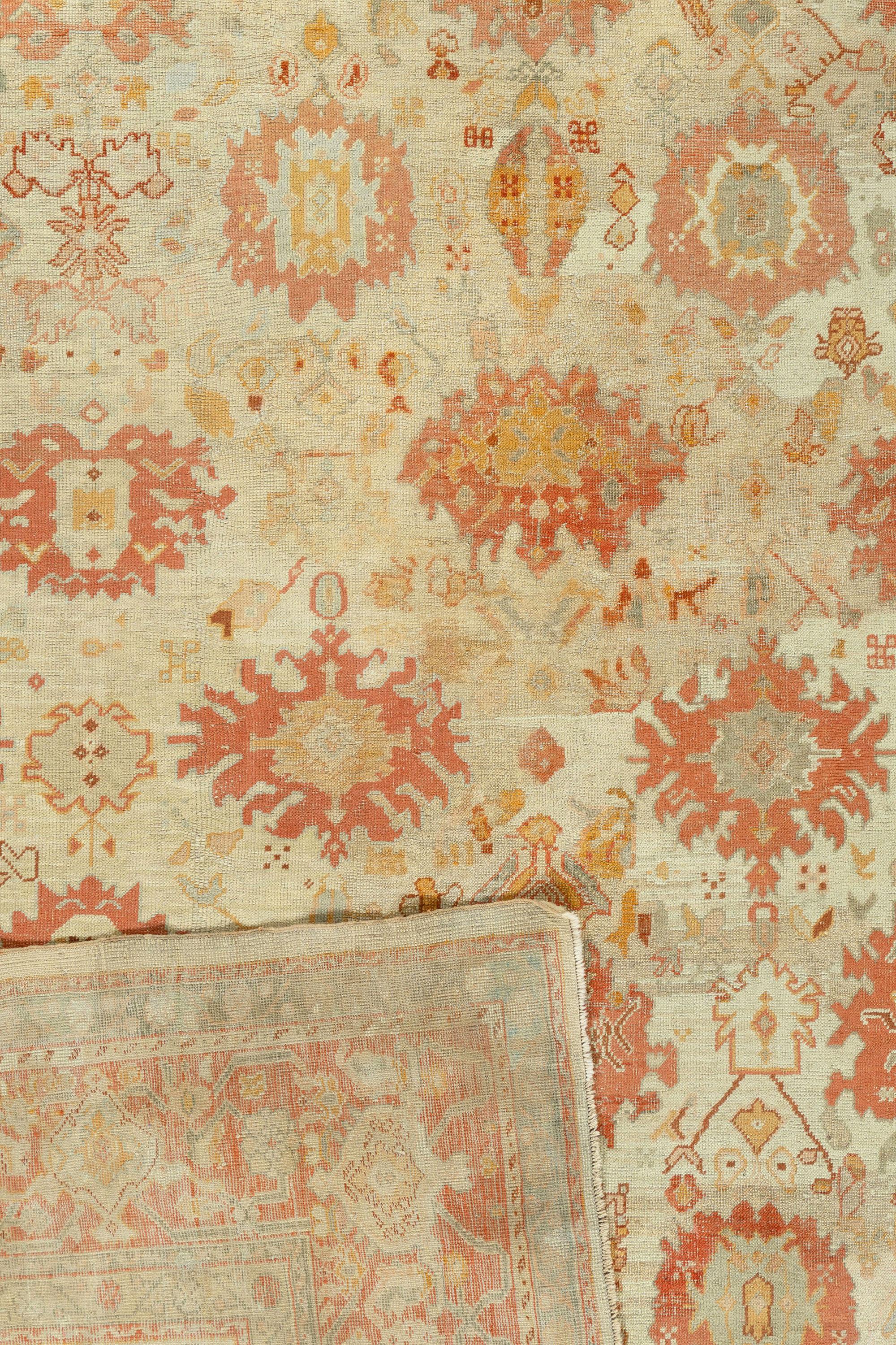 13'7 x 17' Antique Turkish Oushak Rug 13'7 x 17'. This hand woven town carpet displays an allover exploded Harshang design of ragged floating palmettes, ragged lozenges, torn medallions and symmetrized rough palmettes, all on a creamy beige field,