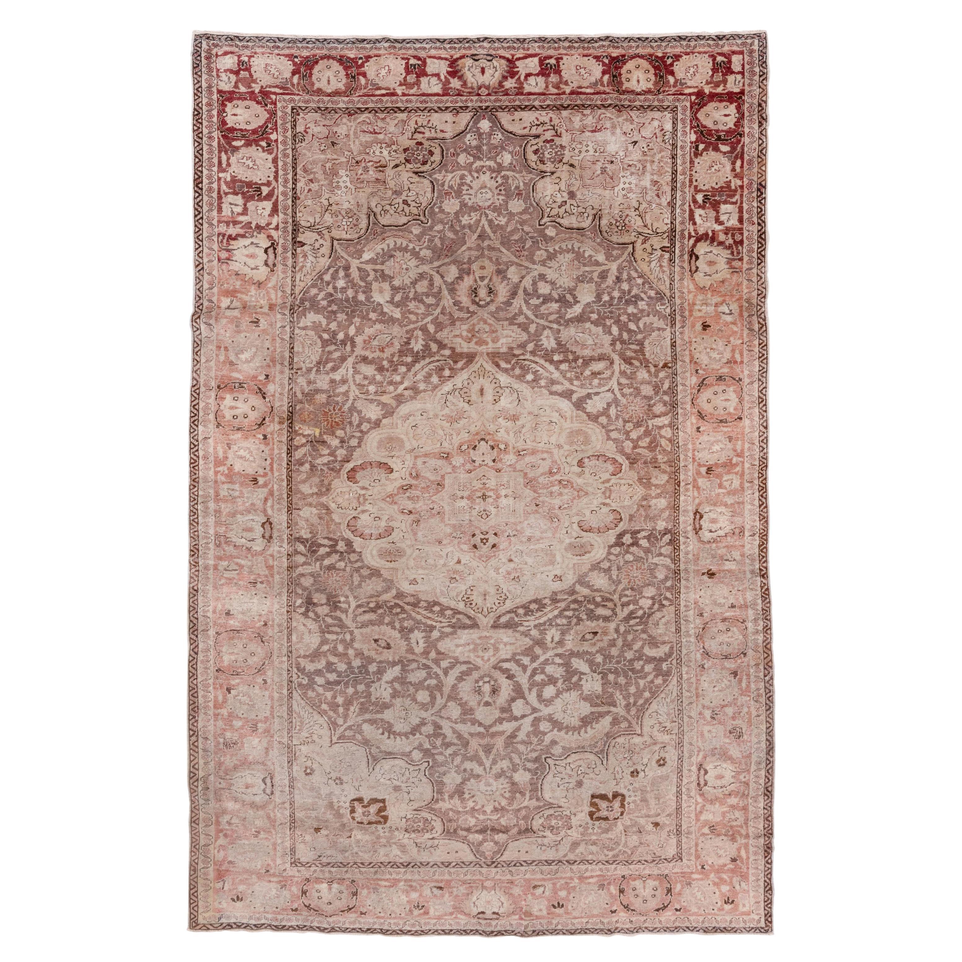 Tapis turc ancien d'Oushak, terrain brun, bordures saumon, médaillon curviligne