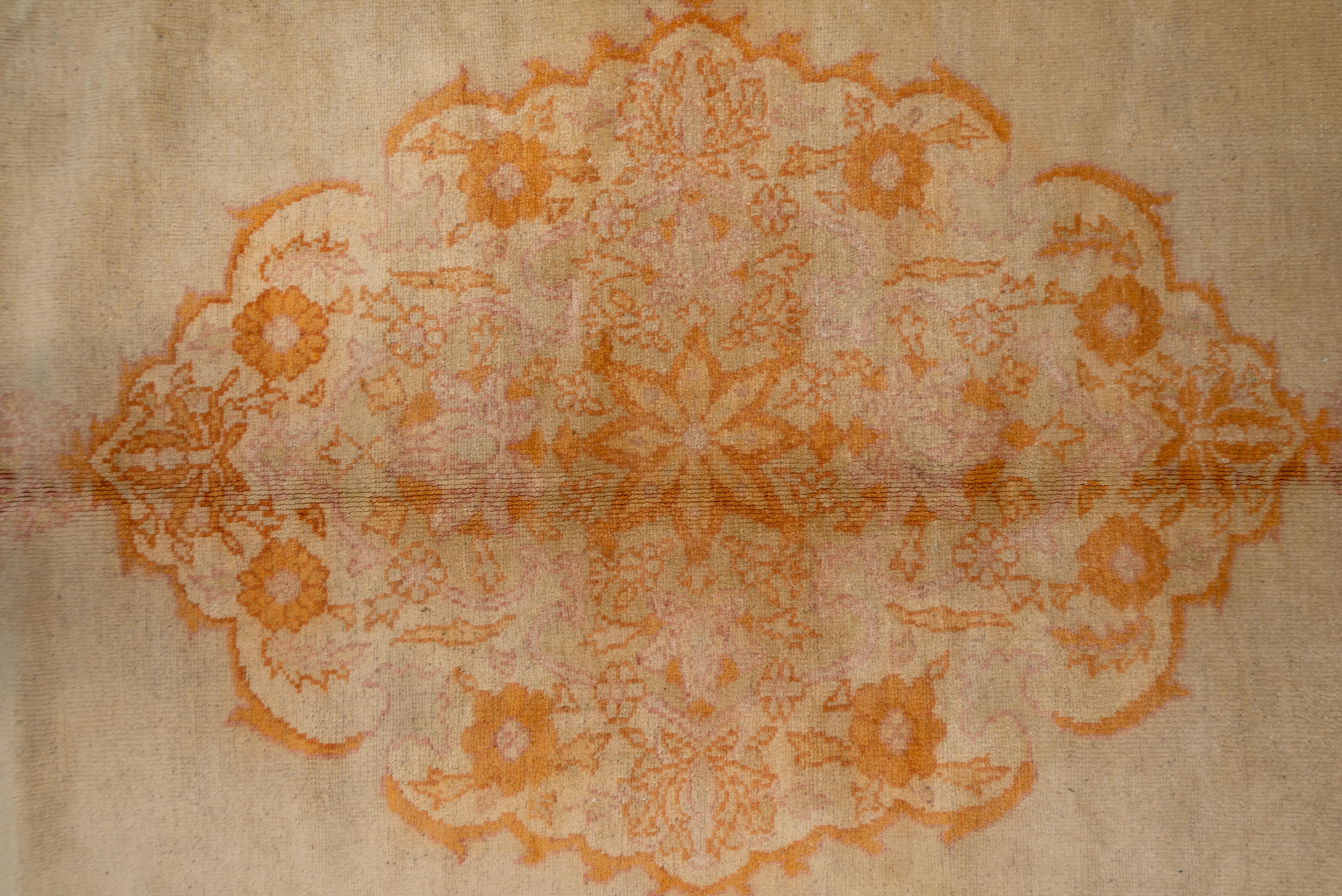 Early 20th Century Antique Turkish Oushak Rug, Ecru Field, Center Medallion, Orange & Pink Accents For Sale
