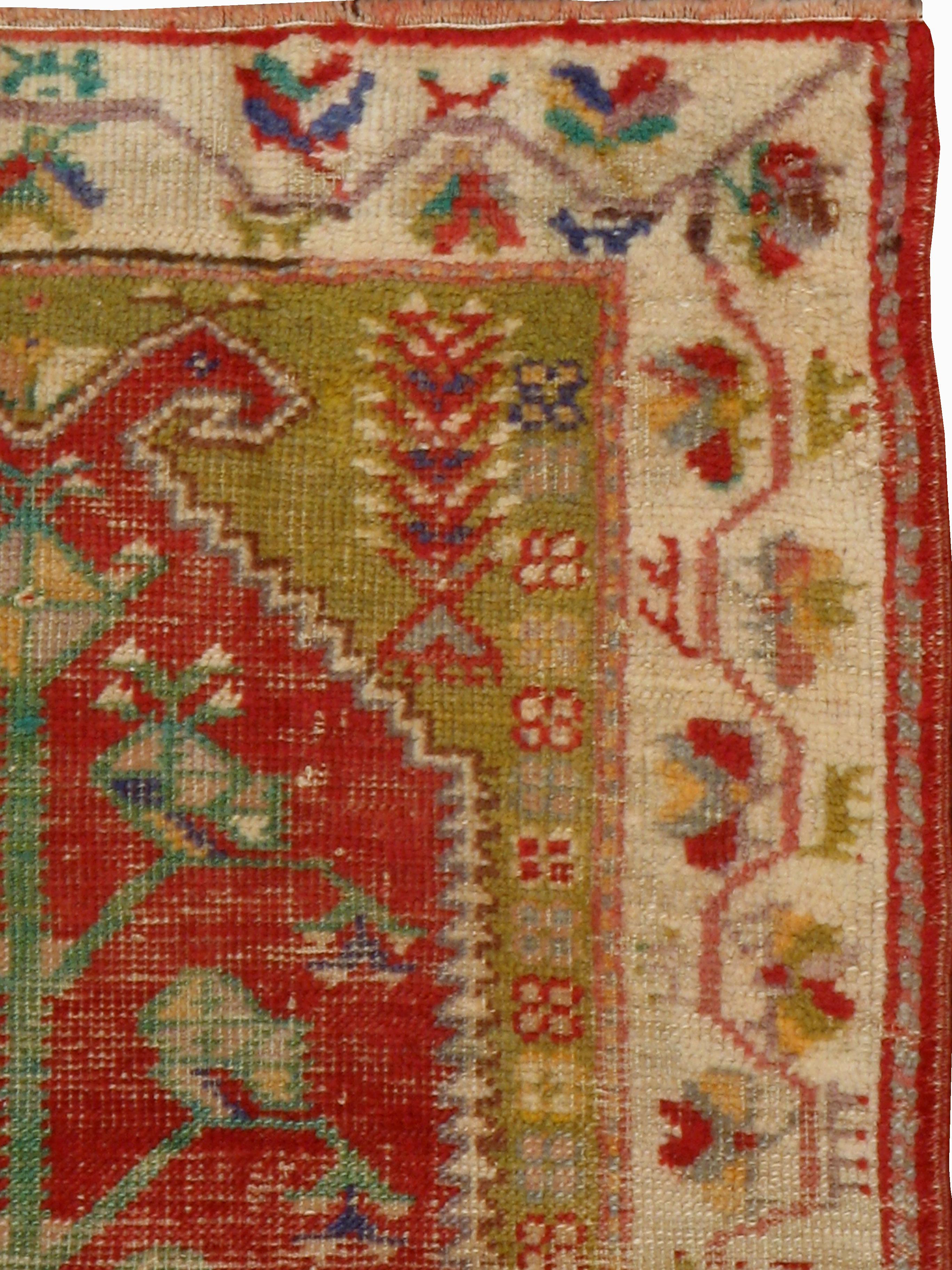 An antique Turkish Oushak rug from the early 20th century with a distressed appeal, but in strong and durable condition.

Measures: 2' 8