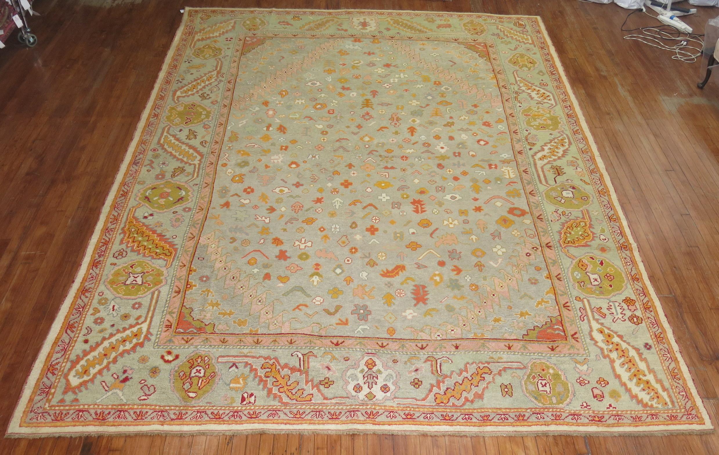 Early 20th century colorful Oushak rug. 

Oushak rugs are prized for their rich looks as well as for their high quality and exceptional beauty, which makes them excellent decorative pieces and in high demand all over the world.