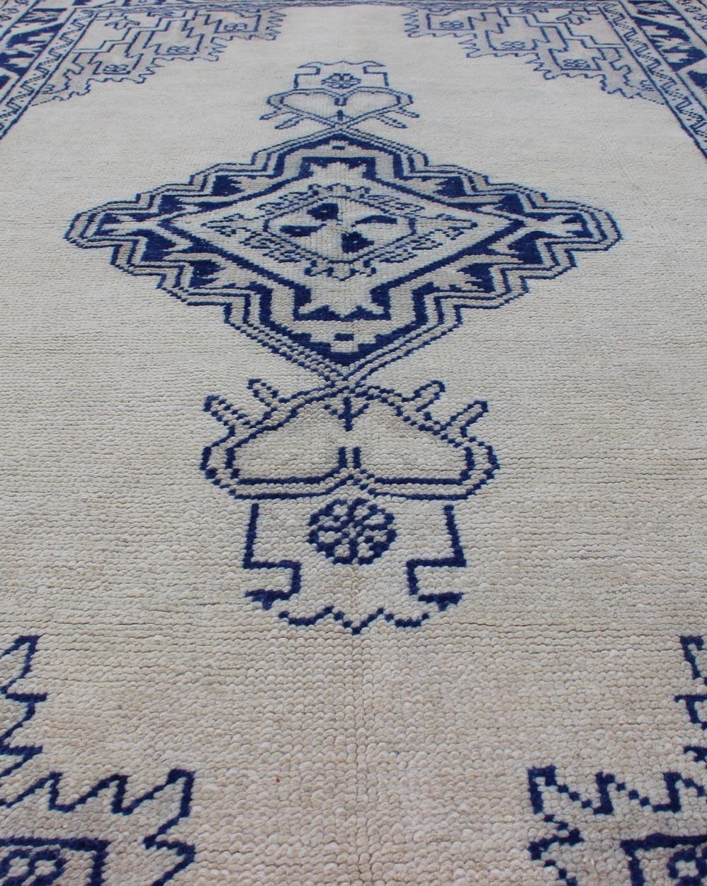 Wool Antique Turkish Oushak Rug in Blue and Cream with Central Medallion For Sale