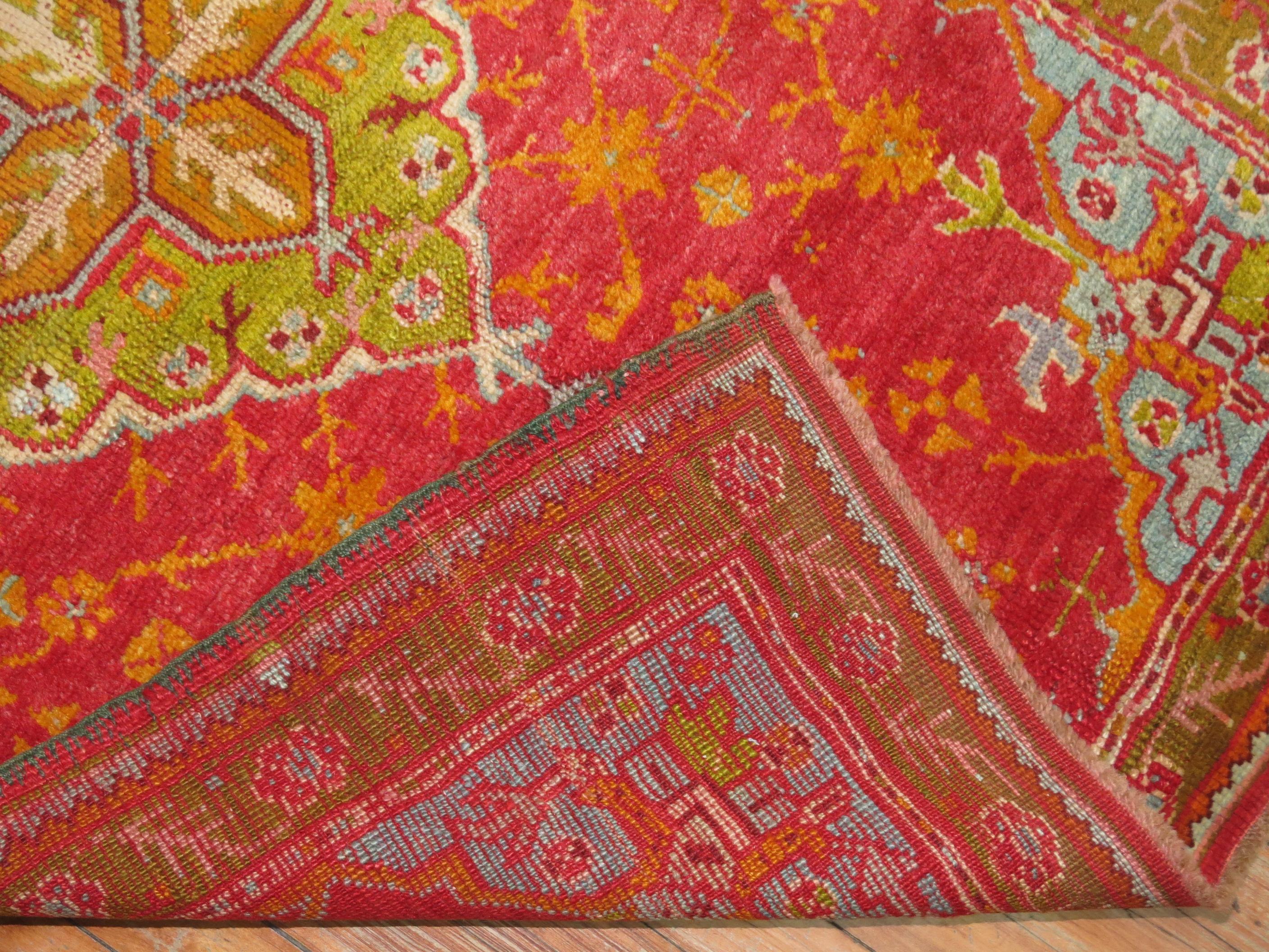 Wonderful one of a kind, handmade, early 20th century Oushak with cheerful colors.