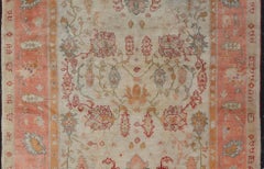 Antique Turkish Oushak Rug in Coral, Ivory and Soft Blue Accents
