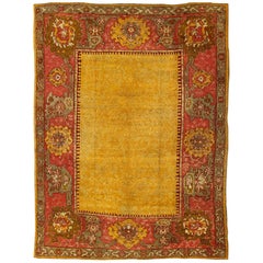 Antique Turkish Oushak rug in gold background, Rose Border 
Green
