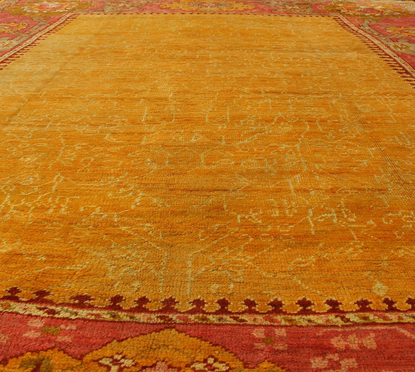 Antique Turkish Oushak rug in gold background, Rose Border & Green  For Sale 3