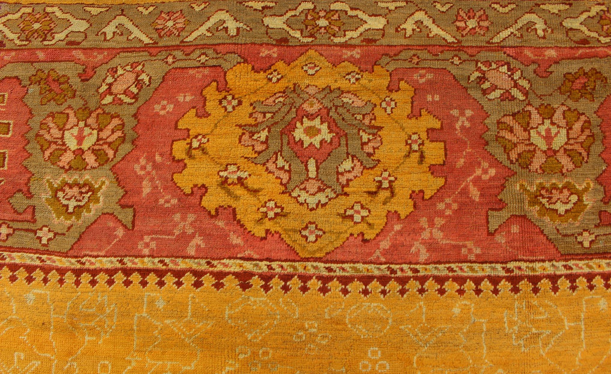 Antique Turkish Oushak rug in gold background, Rose Border & Green  For Sale 1