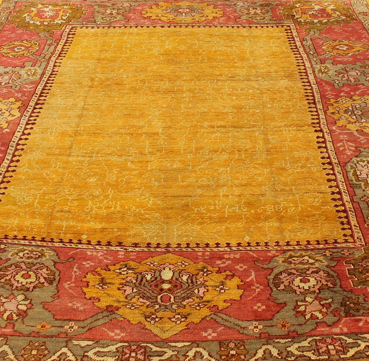 Antique Turkish Oushak rug in gold background, Rose Border & Green  For Sale 2