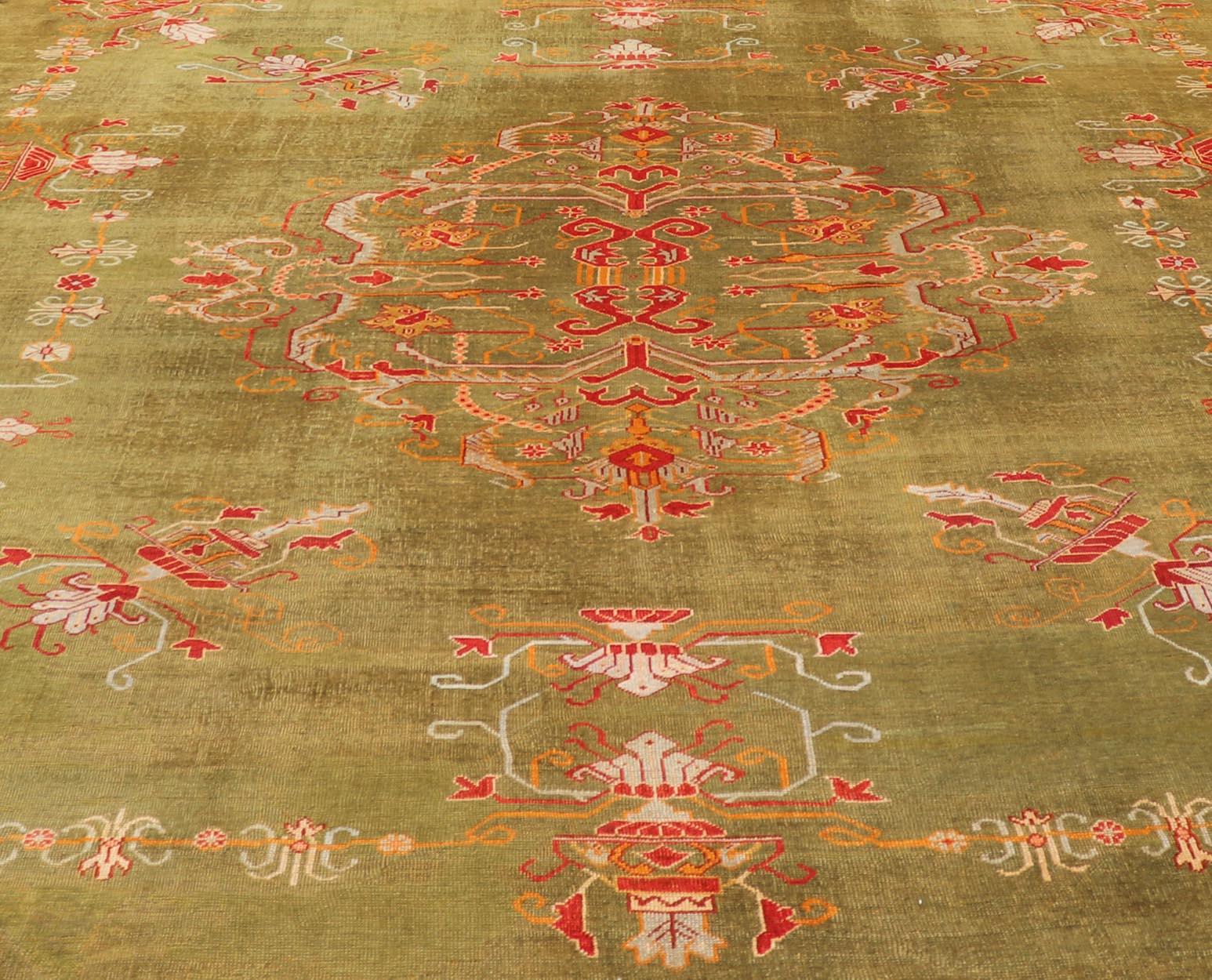 Early 20th Century Antique Turkish Oushak Rug in Green Field, Red, Orange & Rich Colorful Accent For Sale