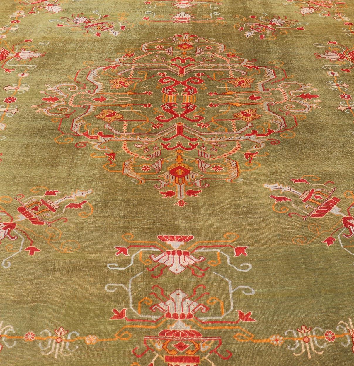 Wool Antique Turkish Oushak Rug in Green Field, Red, Orange & Rich Colorful Accent For Sale