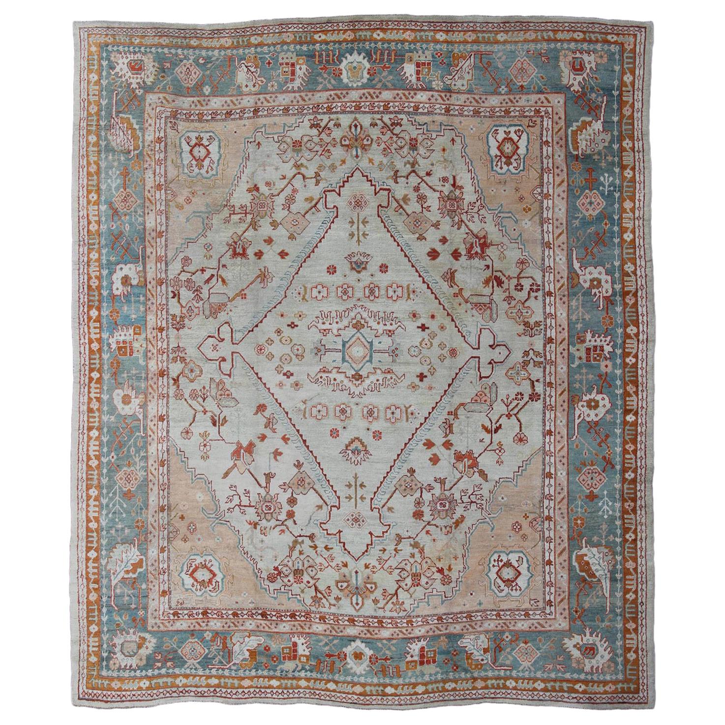 Antique Turkish Oushak Rug in Ice Blue, Taupe Background and Teal Border For Sale