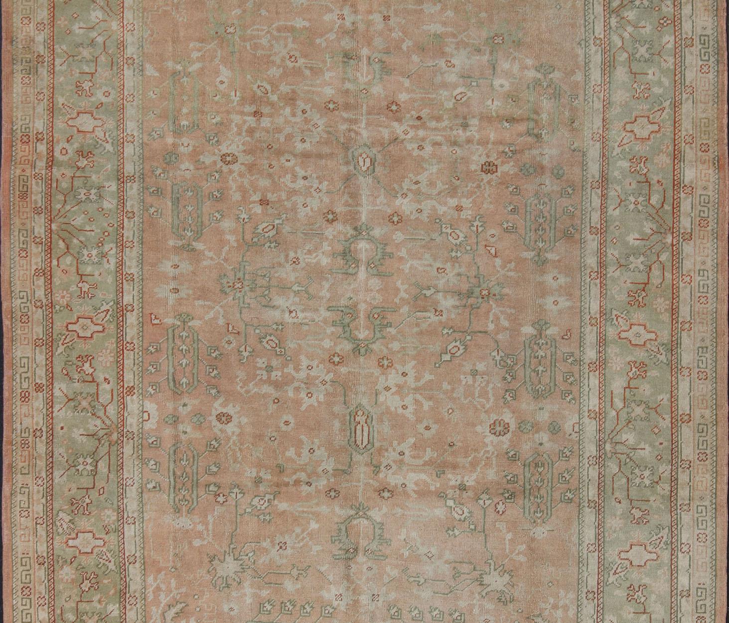 Turkish Classic All Over Design Antique Oushak Rug in Light Coral and Light Green For Sale