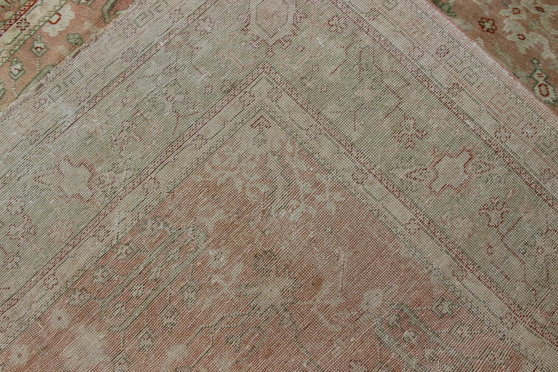 Hand-Knotted Classic All Over Design Antique Oushak Rug in Light Coral and Light Green For Sale