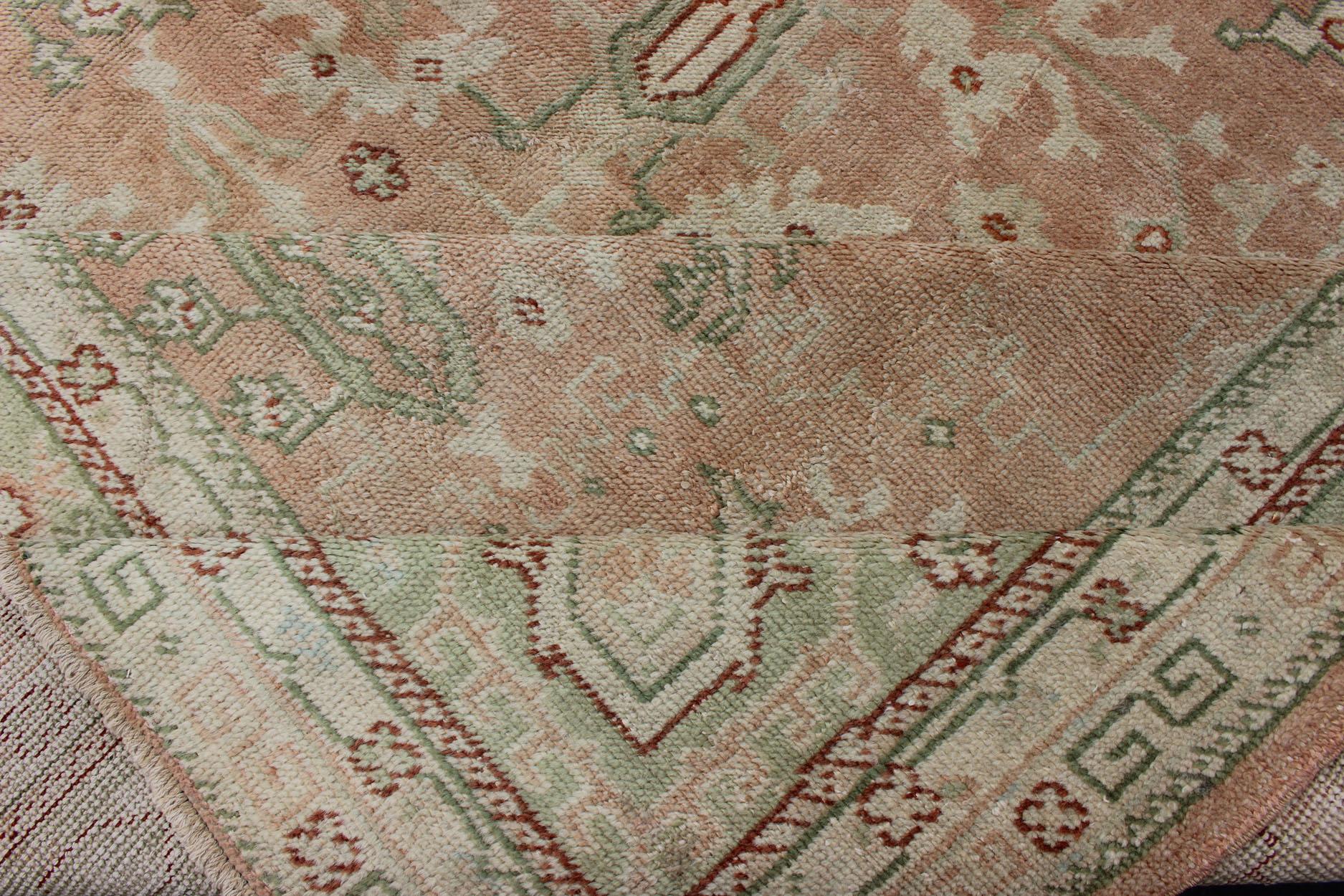 Classic All Over Design Antique Oushak Rug in Light Coral and Light Green In Excellent Condition For Sale In Atlanta, GA