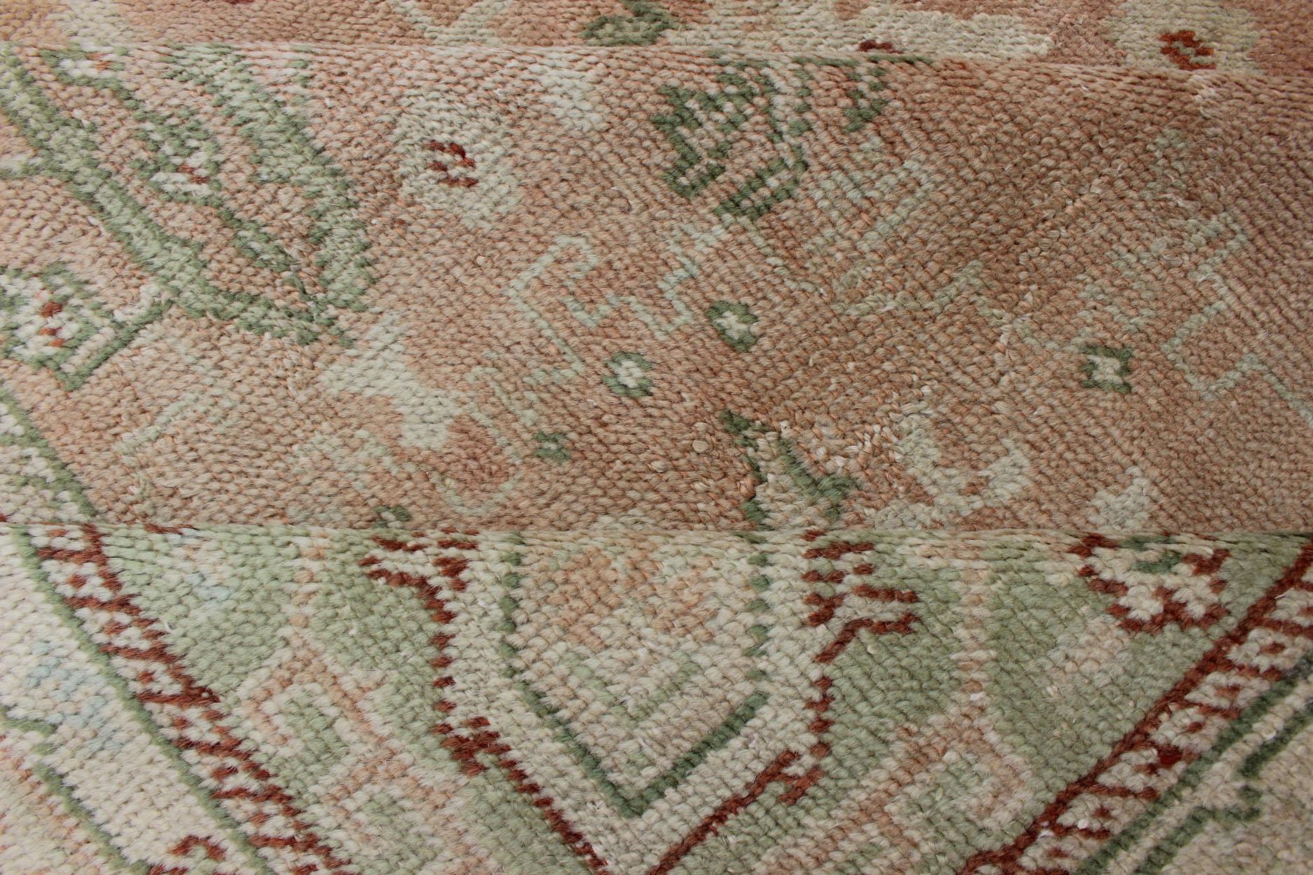 20th Century Classic All Over Design Antique Oushak Rug in Light Coral and Light Green For Sale