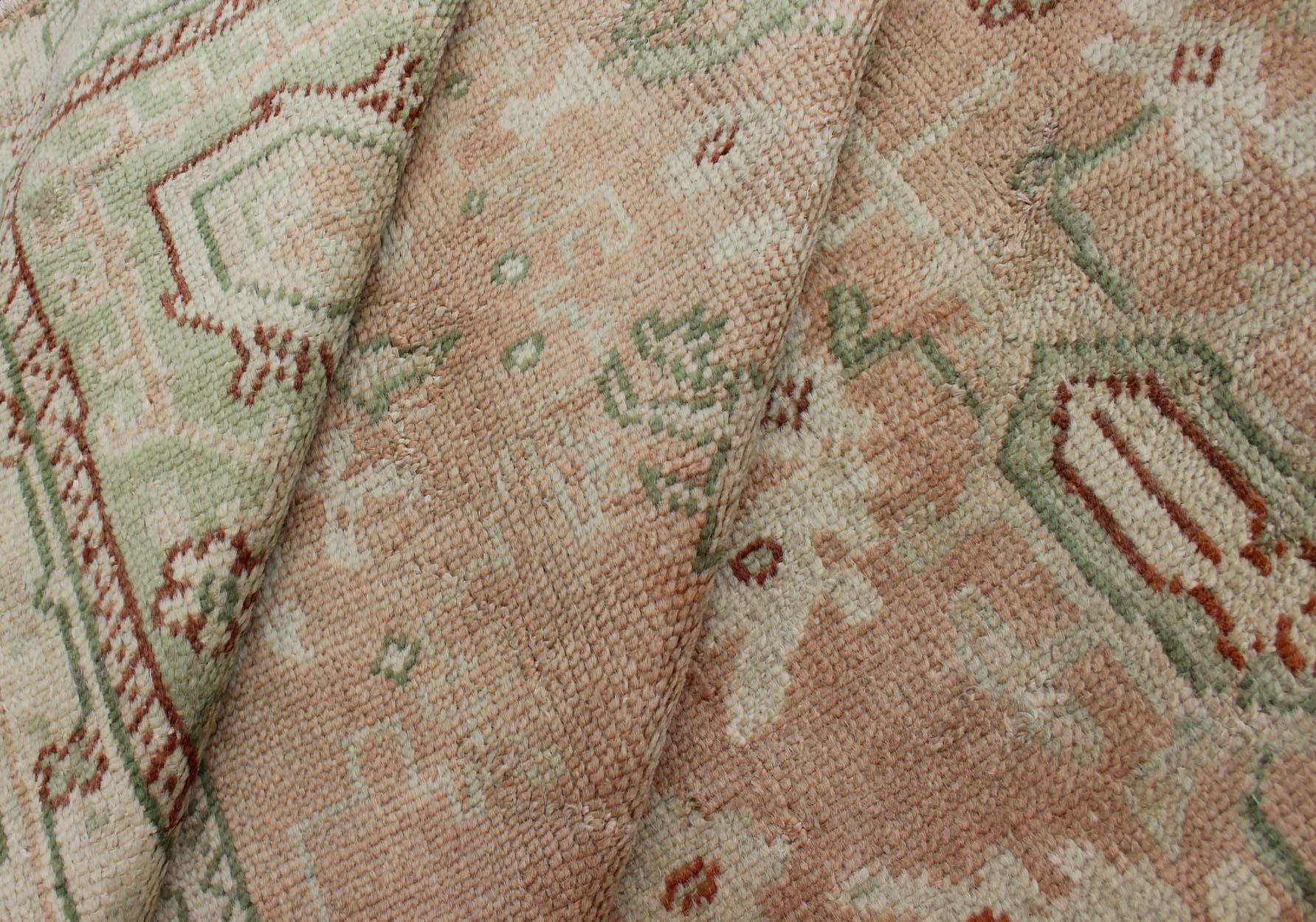 Wool Classic All Over Design Antique Oushak Rug in Light Coral and Light Green For Sale