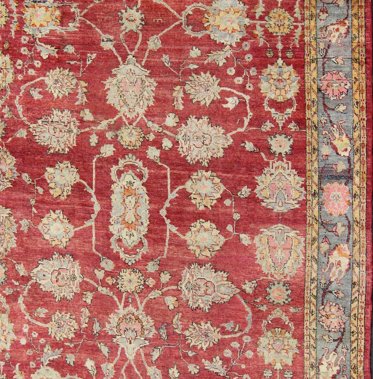 Hand-Knotted Antique Turkish Oushak Rug in Red, Blue/Gray Border, L. Green, Yellow & Pink For Sale