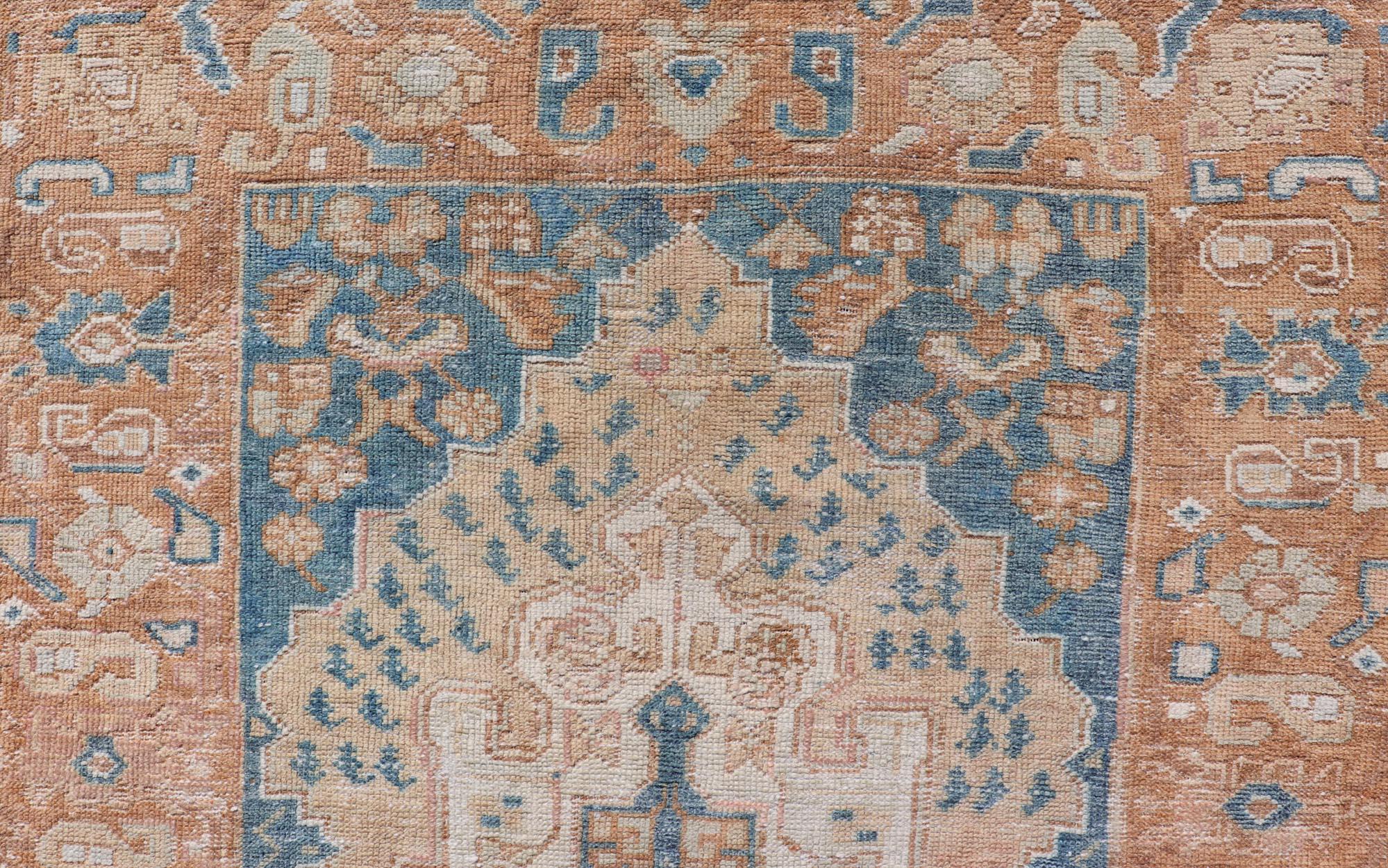 Measures: 3'7 x 5'9 This exquisite antique Turkish Oushak rug captures the timeless beauty of Anatolian craftsmanship. The design features a sophisticated central medallion surrounded by intricate floral motifs and geometric patterns, presented in a