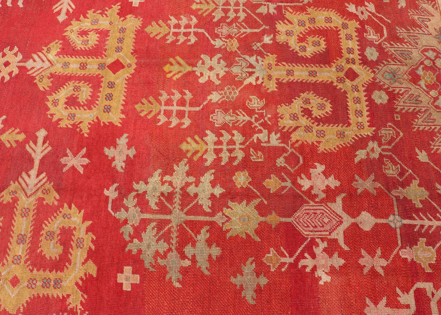Wool Antique Turkish Oushak Rug in Royal Red and Saffron Gold with Geometric Design For Sale