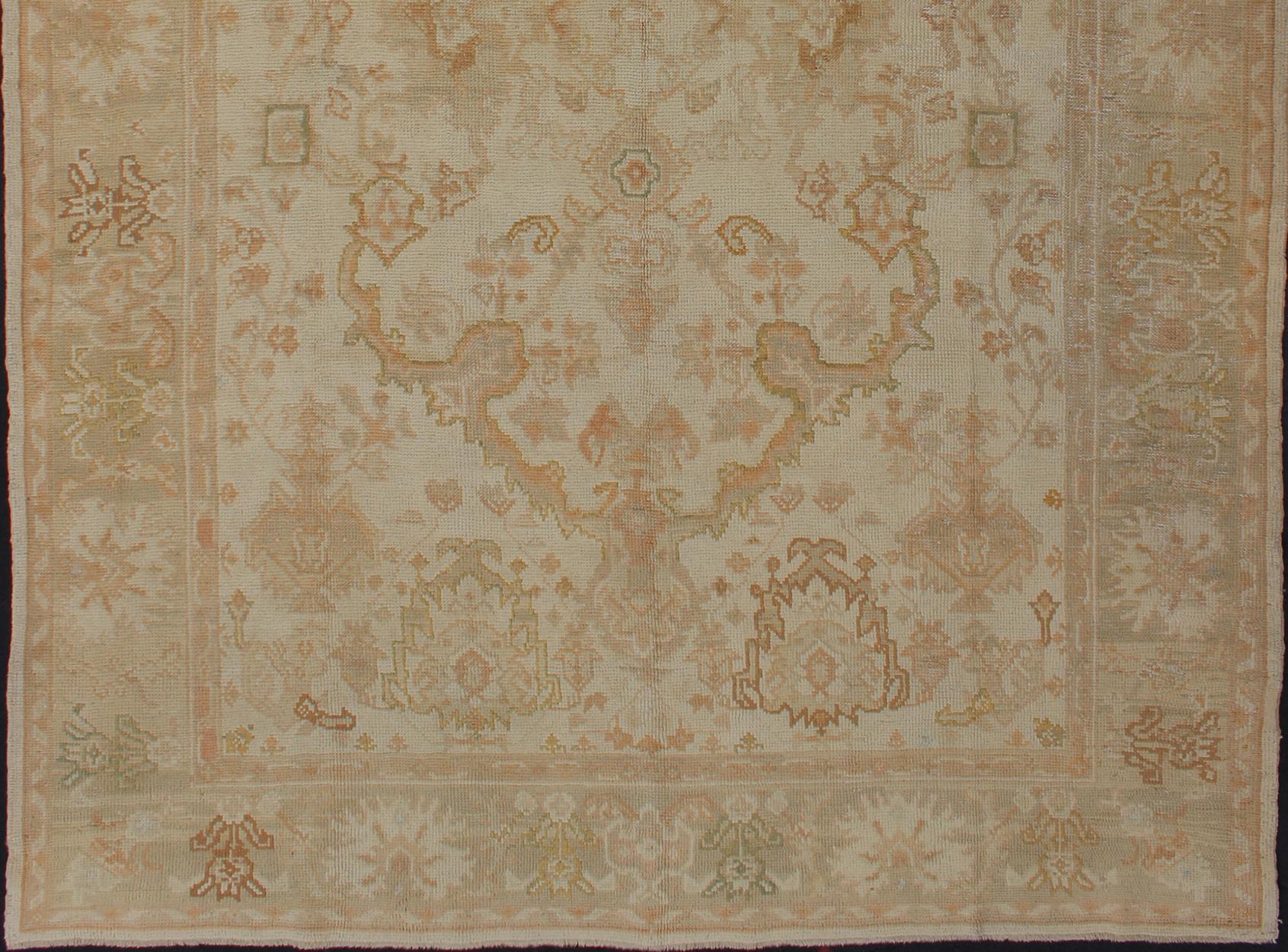 Antique Oushak rug in taupe, beige, green copper, peach, muted brown, Keivan Woven Arts / rug / I-1003. Antique Oushak rug

Measures: 8'3 x 12'10.

This antique Oushak rug bears unmistakably refined beauty due to its highly sophisticated palette of