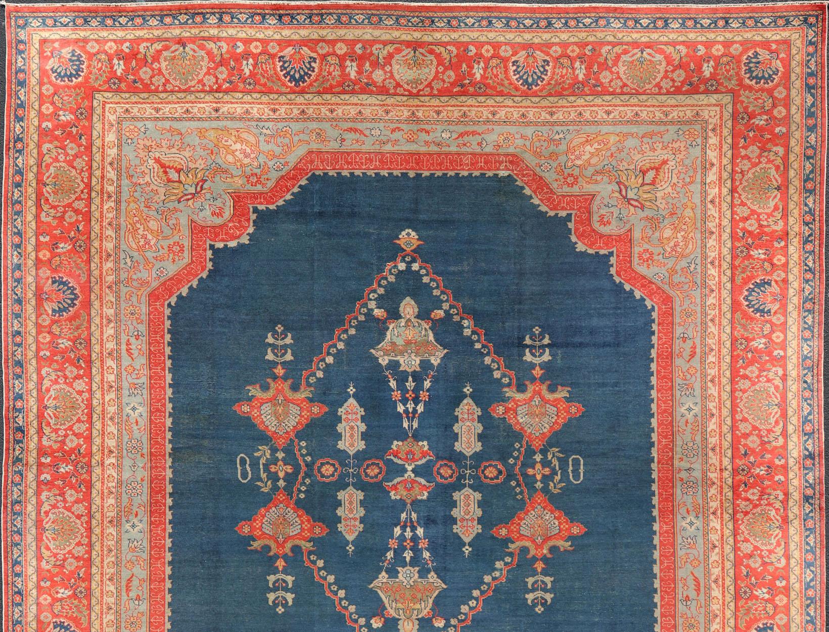 Squared Shape Antique Turkish Oushak rug in vibrant blue, red, medallion geometric design, kwarugs Keivan Woven Arts / R20-0834. Colorful Oushak in vibrant colors. 
Measures: 14'9 x 16'7.
This Antique Turkish Oushak rug showcases a large center