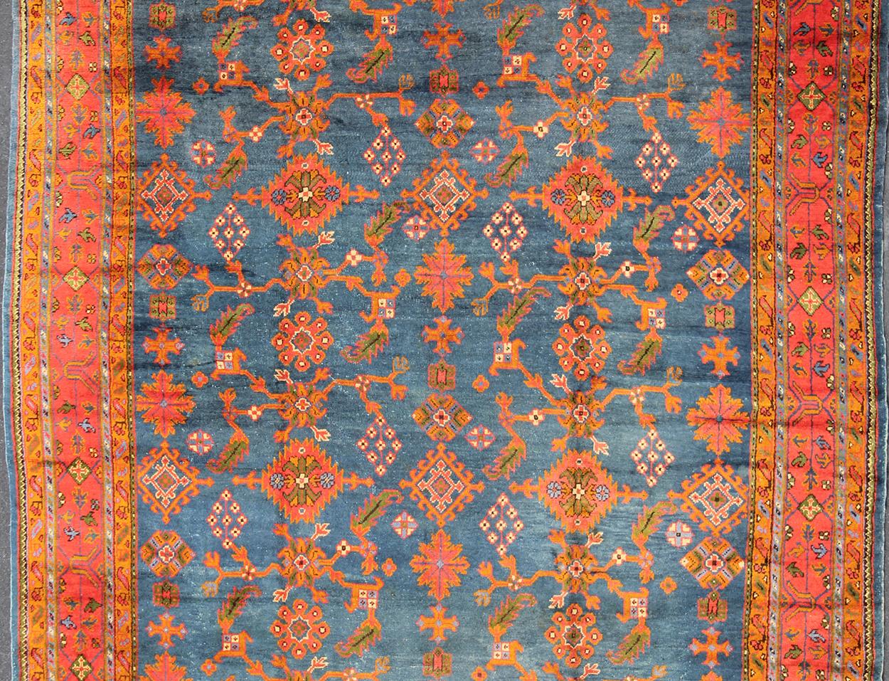 Antique Turkish Oushak Rug in Vibrant Blue, Red, Green with All-Over Design In Excellent Condition For Sale In Atlanta, GA