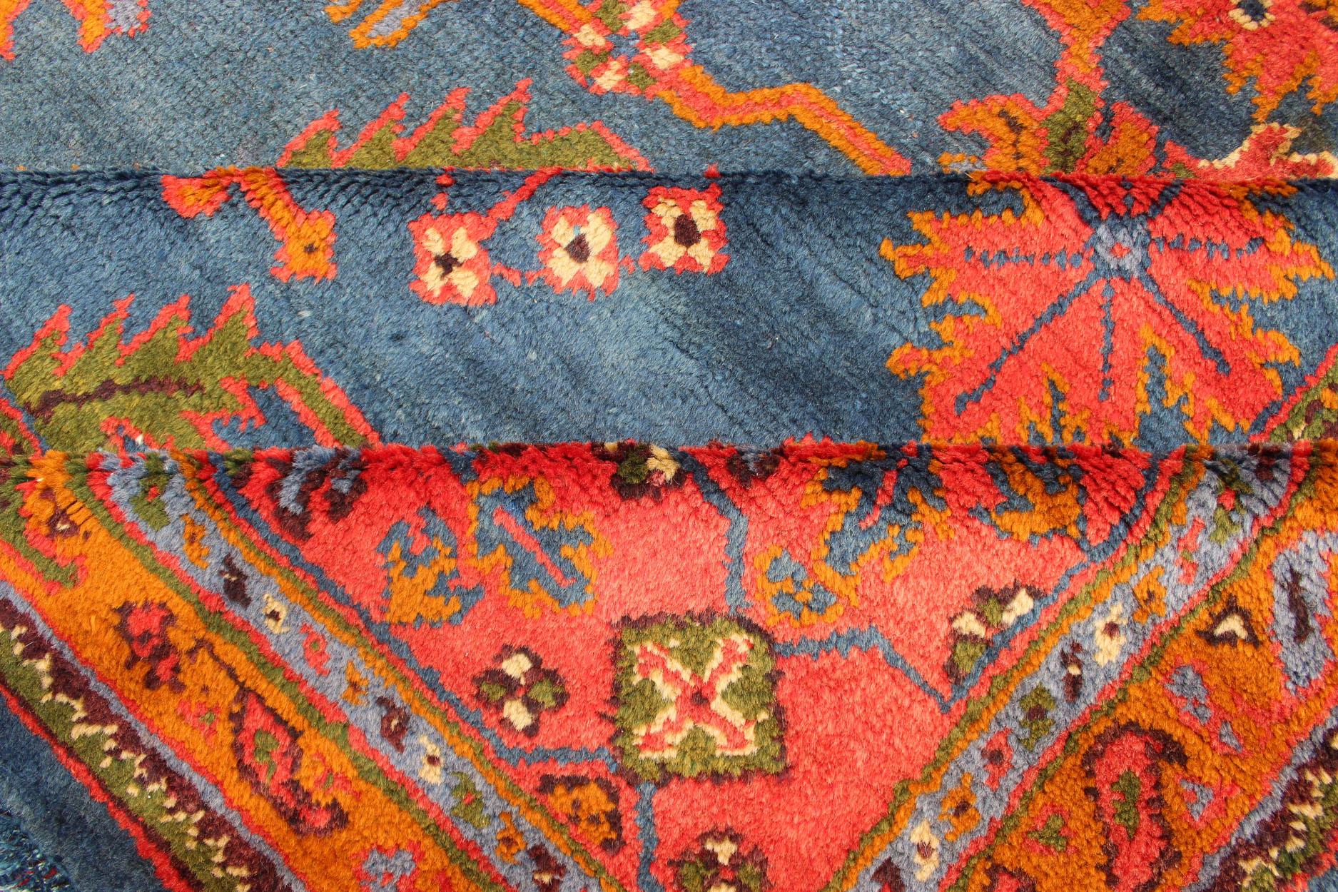Wool Antique Turkish Oushak Rug in Vibrant Blue, Red, Green with All-Over Design For Sale