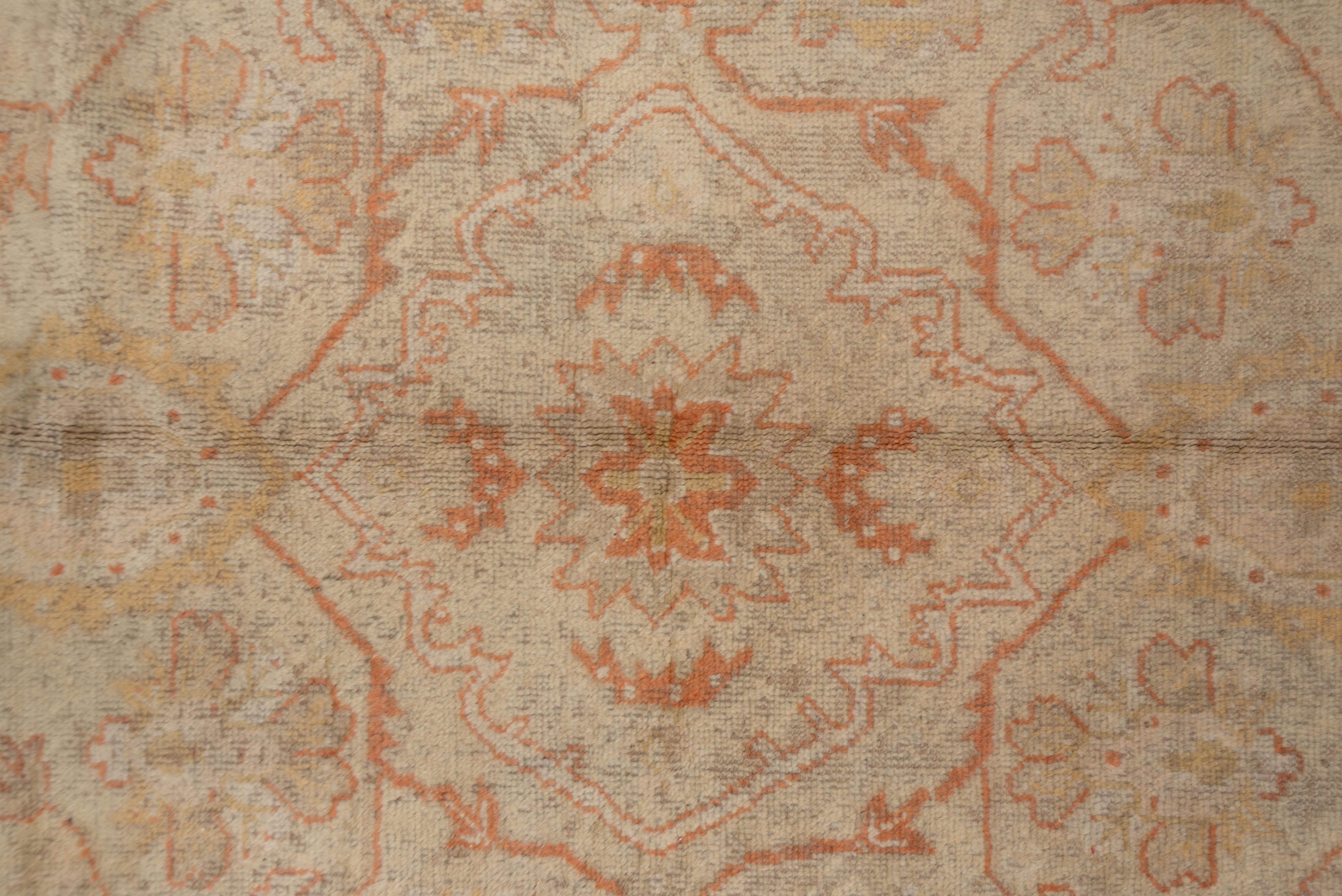Antique Turkish Oushak Rug, Neutral Field, Orange Borders & Accents, circa 1910s In Good Condition For Sale In New York, NY