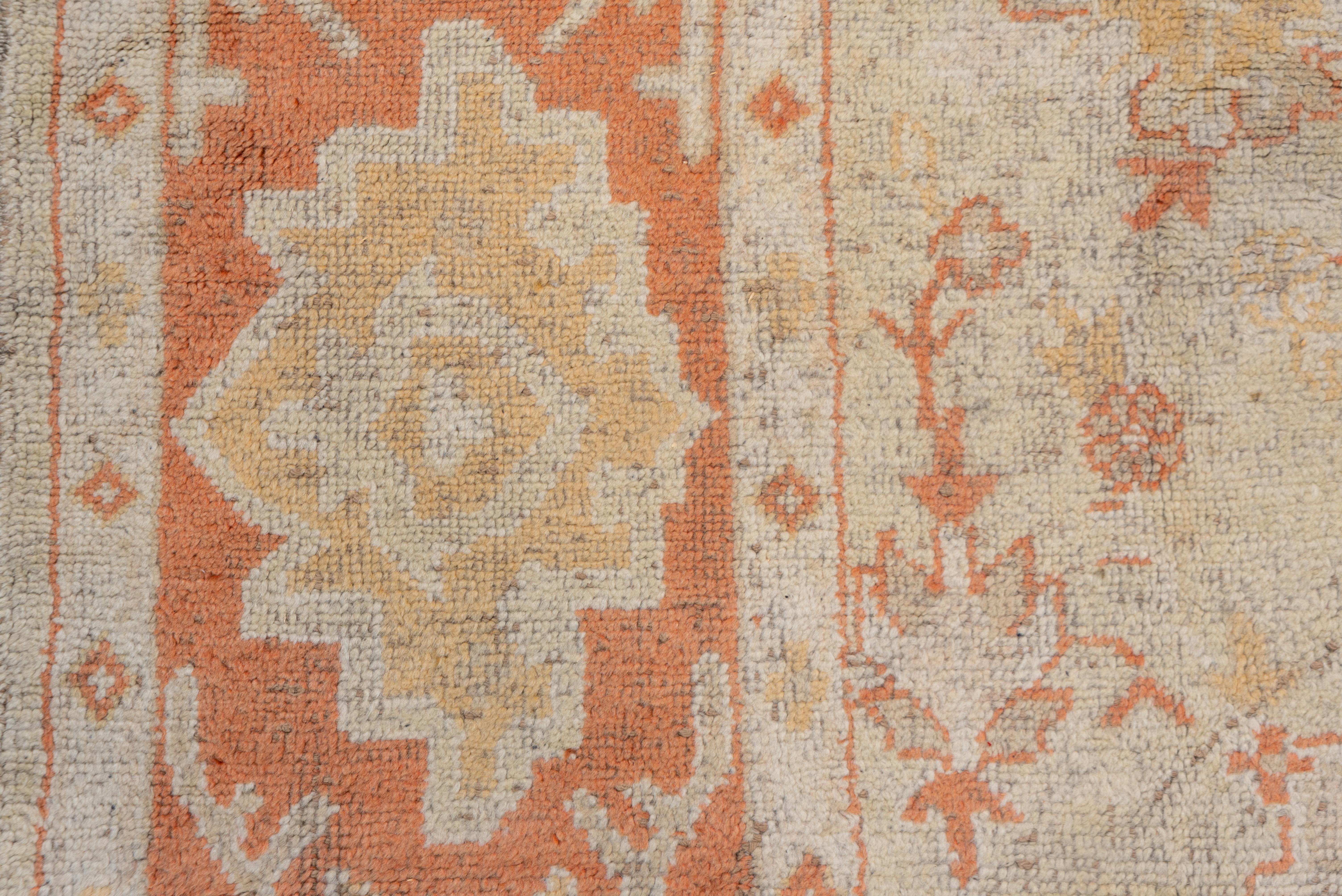 Wool Antique Turkish Oushak Rug, Neutral Field, Orange Borders & Accents, circa 1910s For Sale