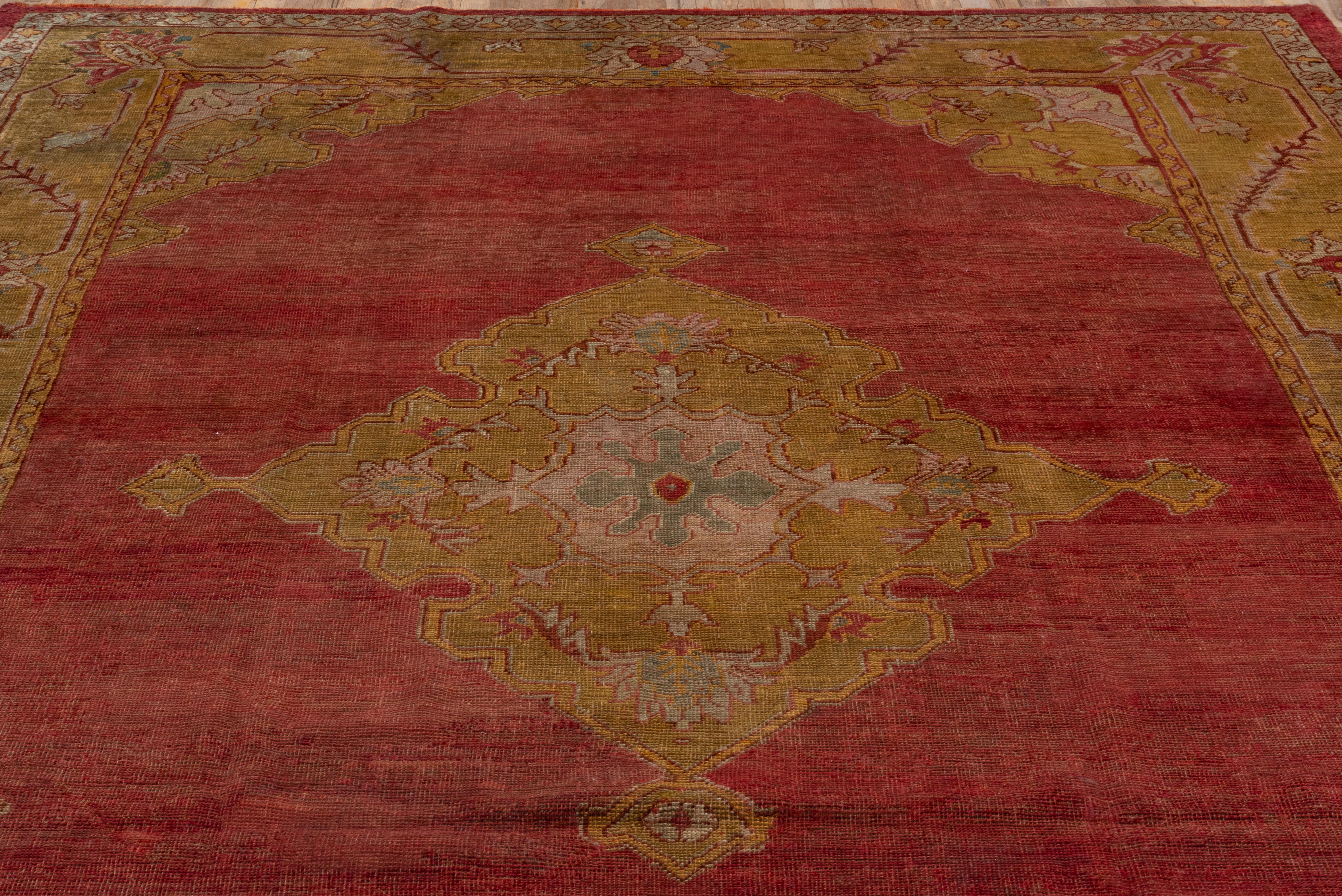 Wool Antique Turkish Oushak Rug, Red Field and Gold Borders, Center Medallion For Sale