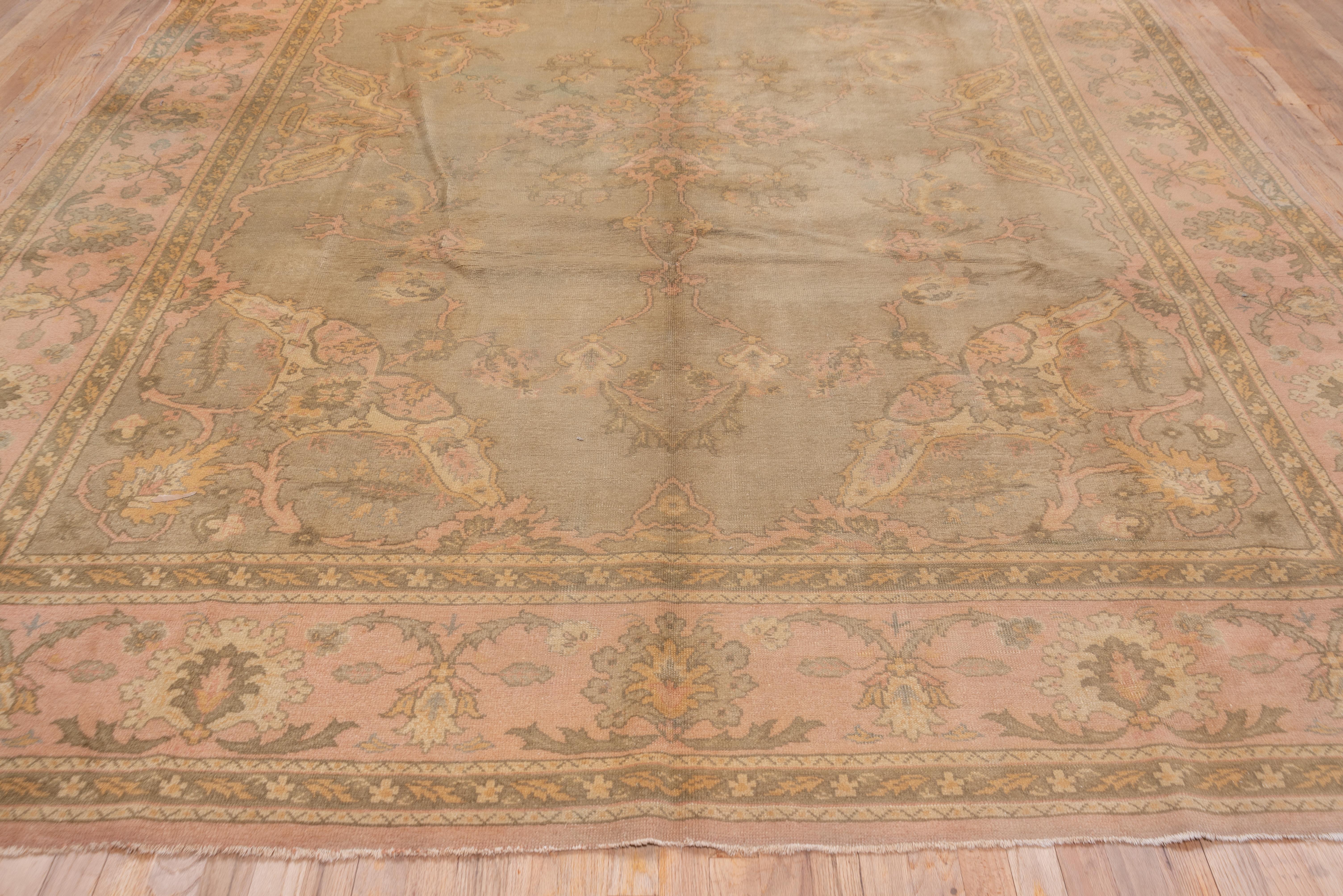 Early 20th Century Antique Turkish Oushak Rug, Sage Green Field, Light Pink Borders, circa 1920s For Sale