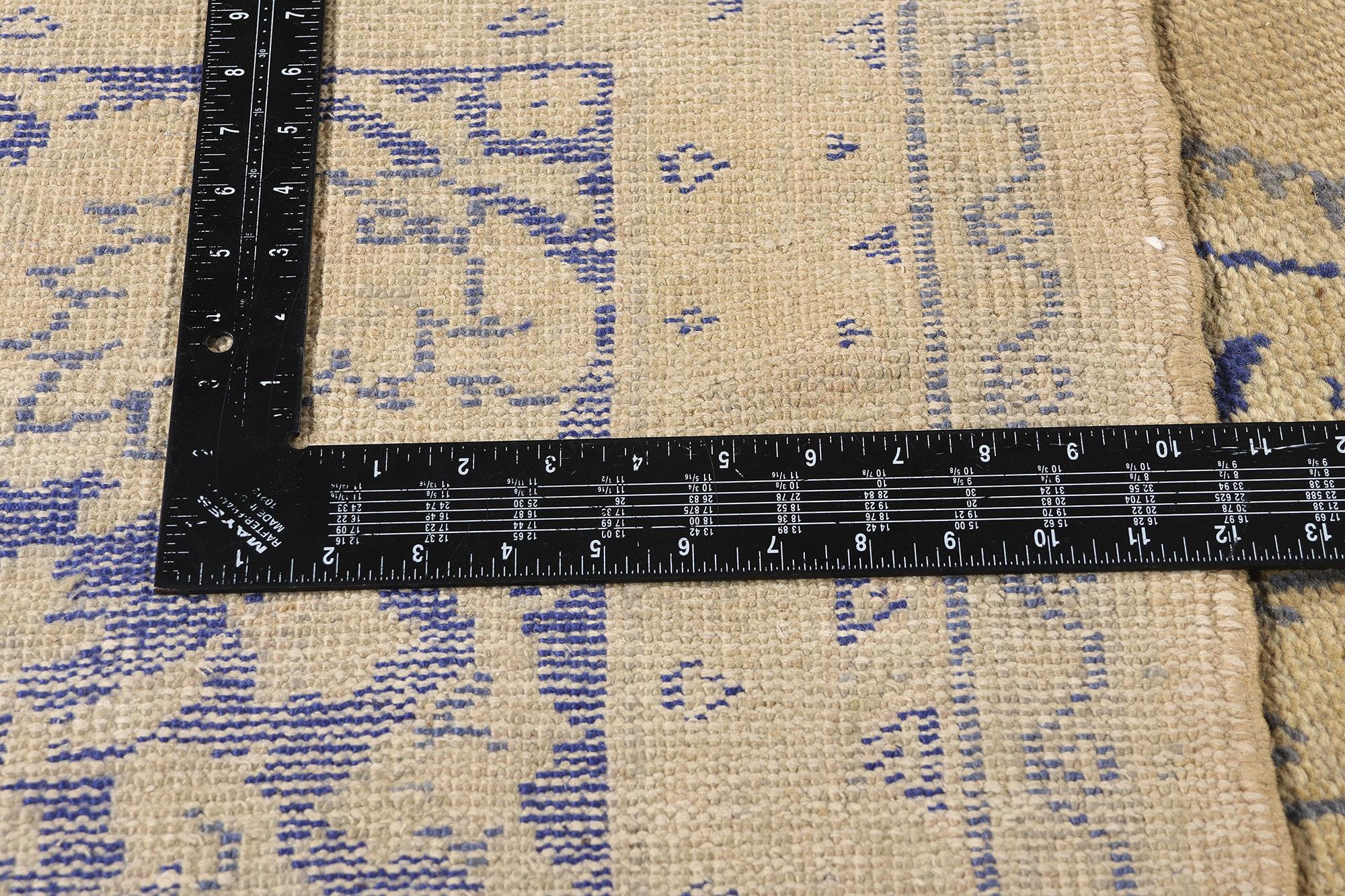 51291 Antique Turkish Oushak Rug, 09'04 x 12'02. Bathed in the faded splendor of indigo dreams and Anatolian twilight, this hand-knotted wool rare antique Turkish Oushak rug is a portrait of poetic memory rendered in thread. At the heart of its soft