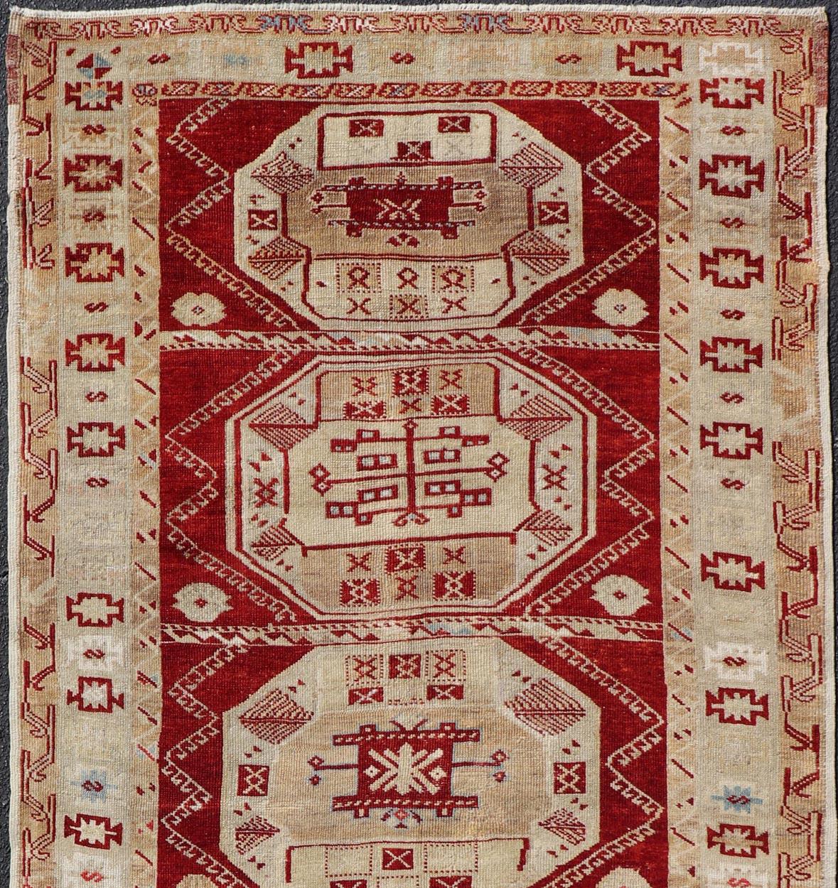 Wool Antique Turkish Oushak Rug with Deep Red, Ivory Tones and Medallions 4'8 x 9'6 For Sale