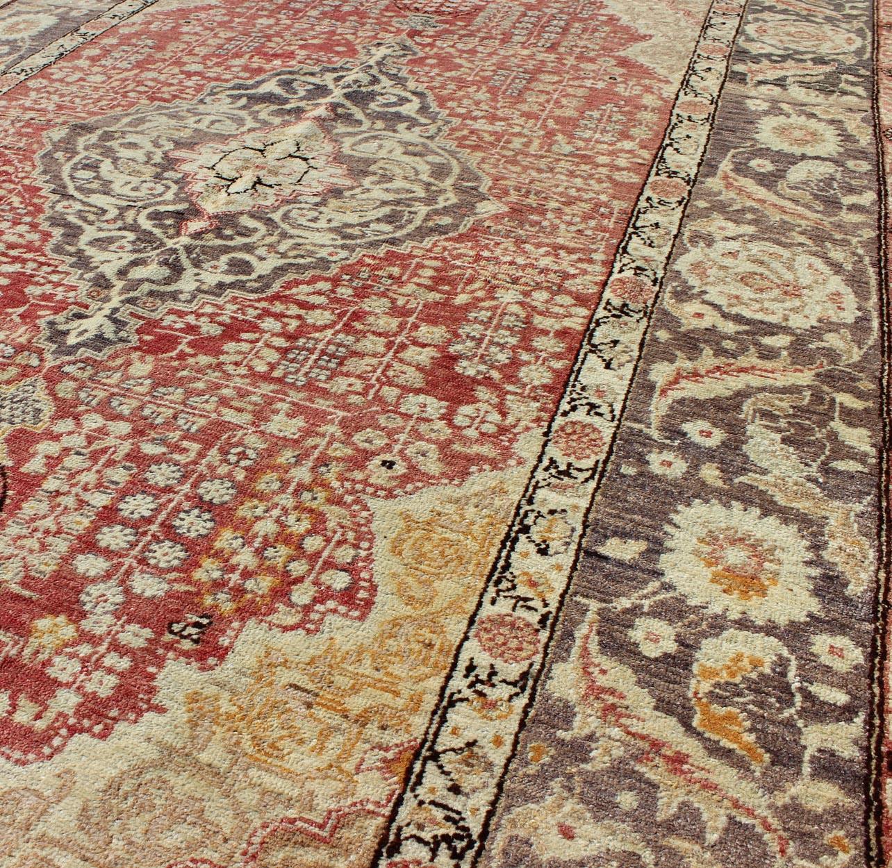Hand-Knotted Antique Turkish Oushak Rug with Floral Medallion Design in Red and Charcoal For Sale
