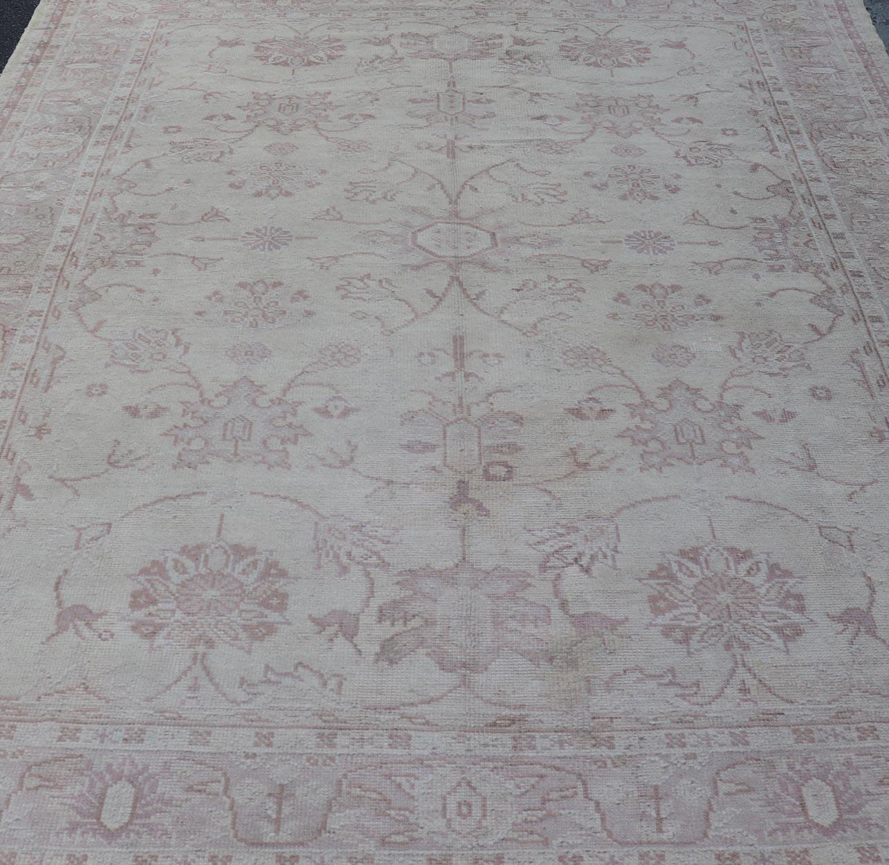 Mid-20th Century Antique Turkish Oushak Rug with Floral Patterns in Cream and Neutral Colors  For Sale