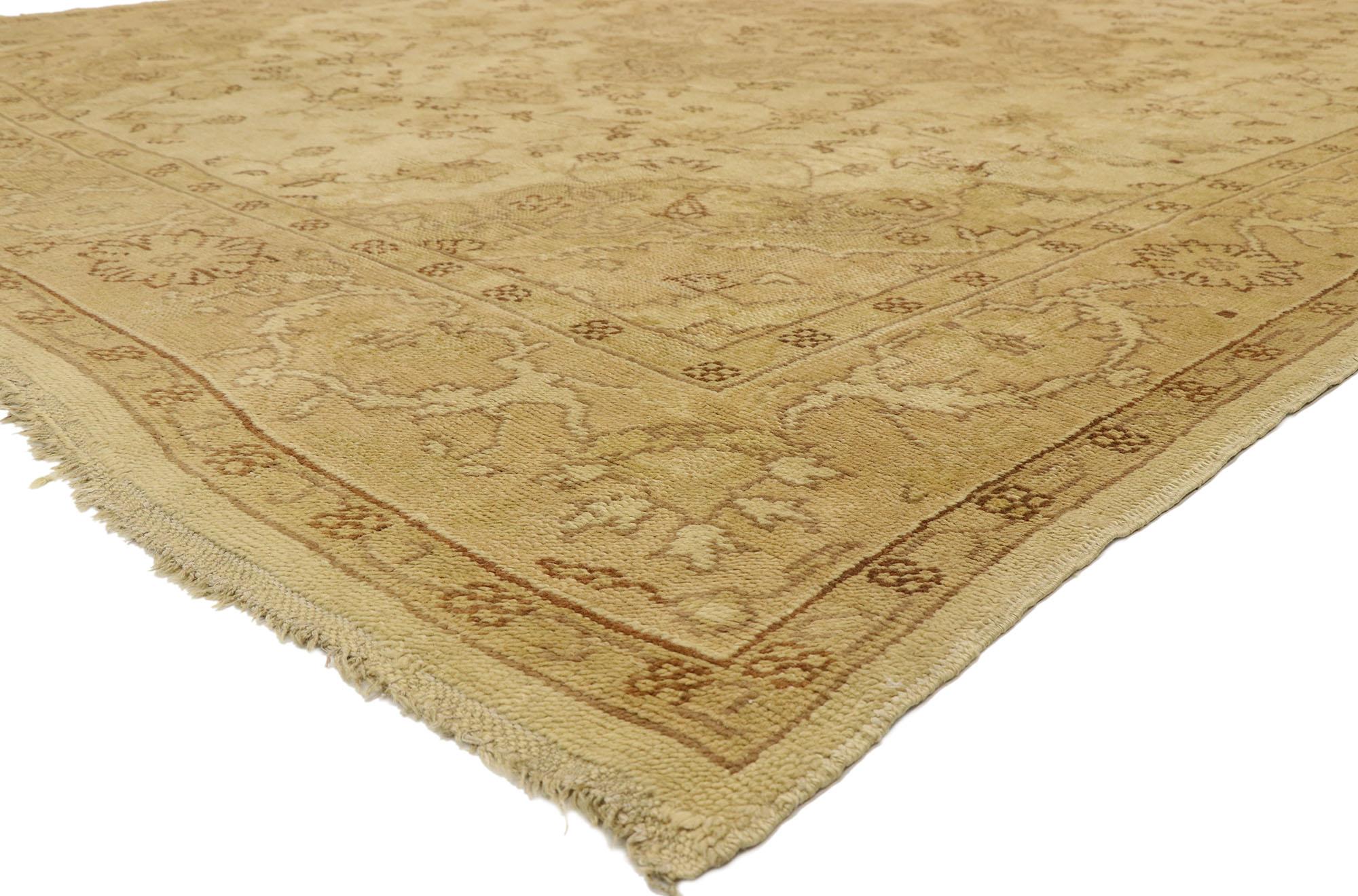 74056 antique Turkish Oushak rug with French Country style and European Cottage Charm. Warm and inviting combined with a timeless design, this hand knotted wool antique Turkish Oushak rug beautifully embodies French Country style and European