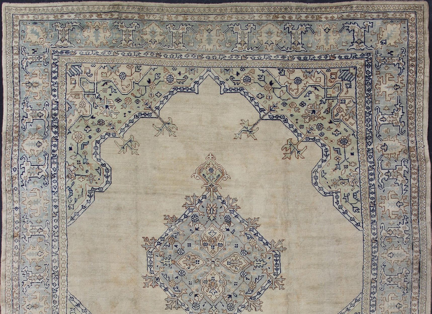 Antique Turkish Oushak with Geometric Motifs in Champagne Field and Accent Blue, Oushak antique rug from Turkey. Keivan Woven Arts / rug R20-0303, country of origin / type: Turkey / Oushak, circa 1920
Measures: 12'2 x 14'5 
This beautiful rug from