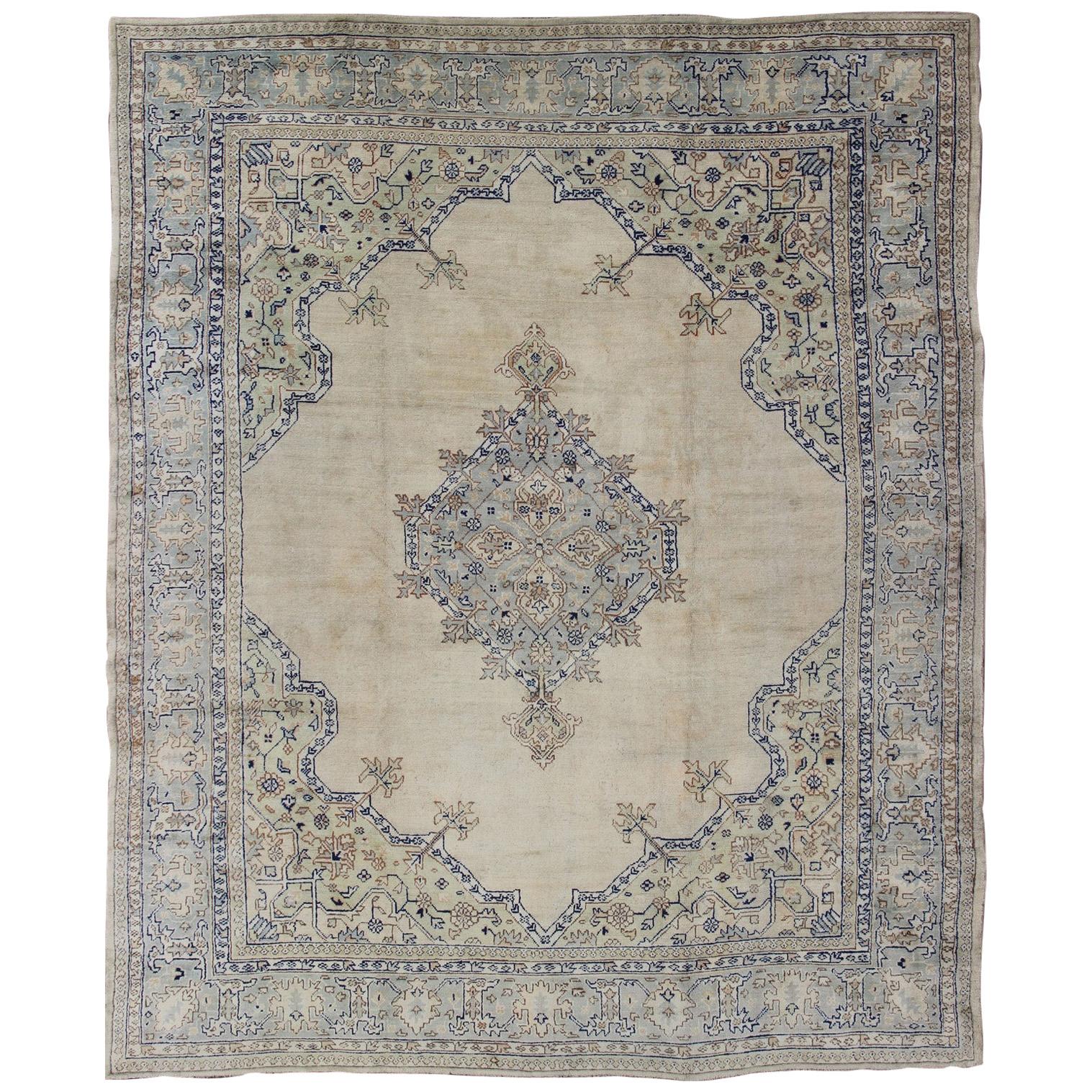 Antique Turkish Oushak with Geometric Motifs in Champagne Field and Accent Blue For Sale