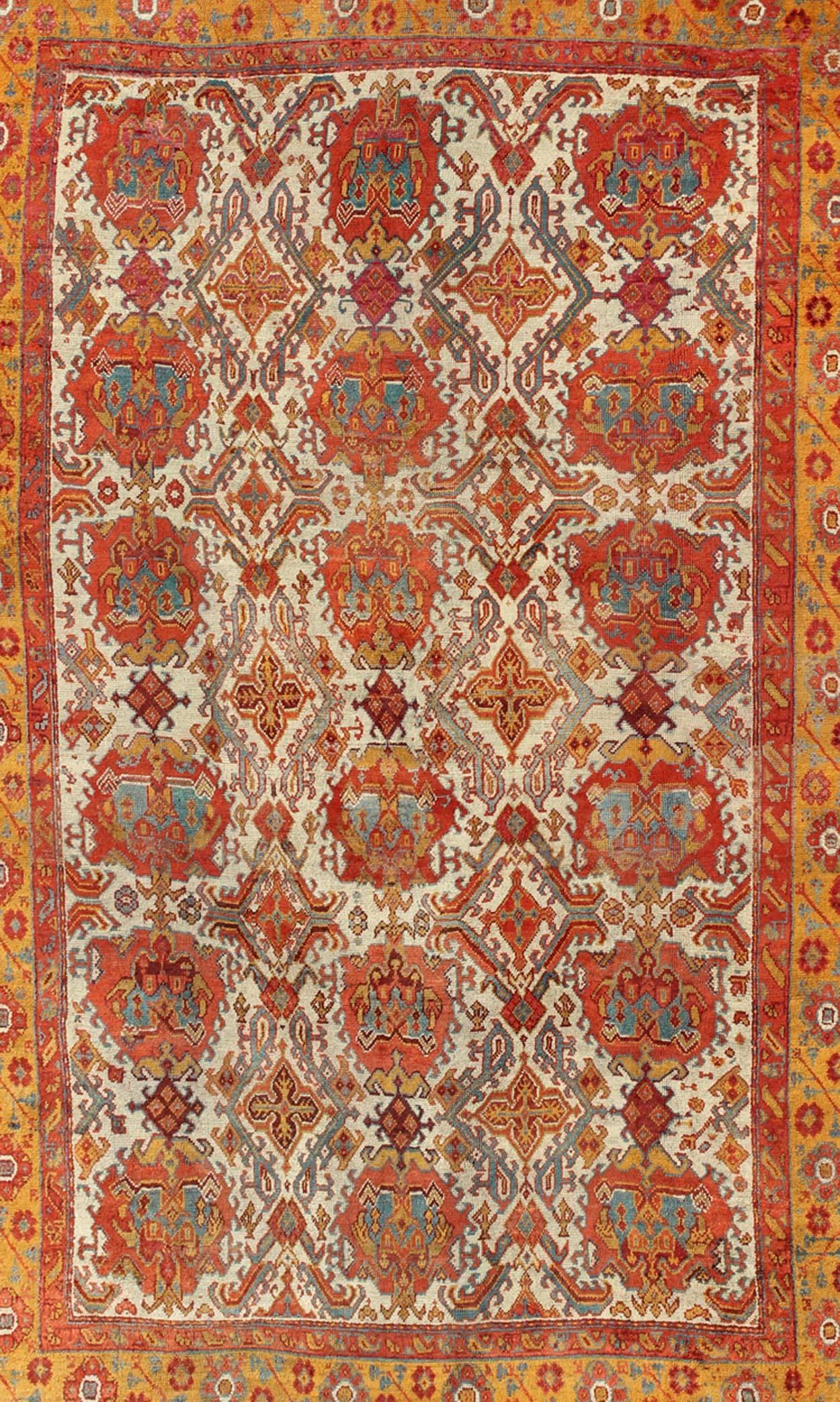 Hand-Knotted Antique Turkish Oushak Rug with Multi-Medallions in Ivory, Orange, Red & Blue For Sale
